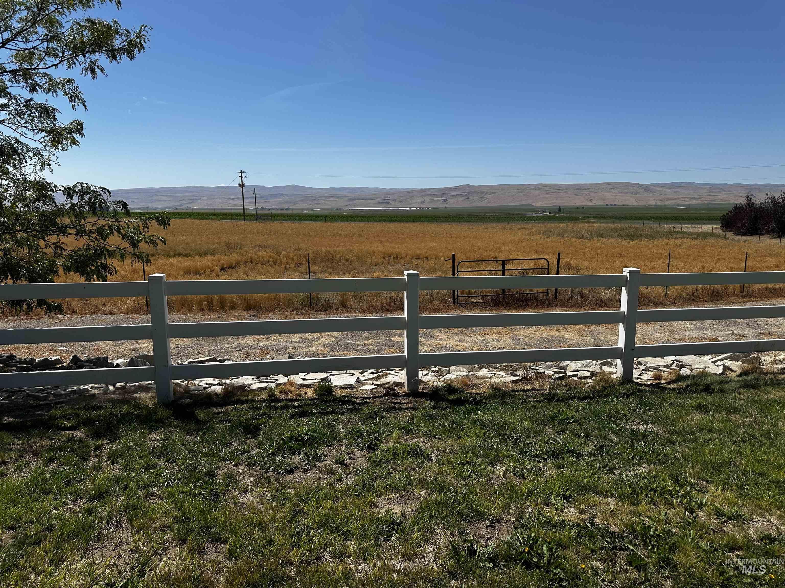 View of yard with a view of countryside and a mountain view