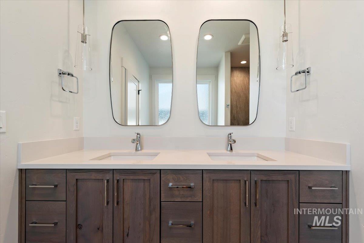 Full bathroom with a sink and recessed lighting
