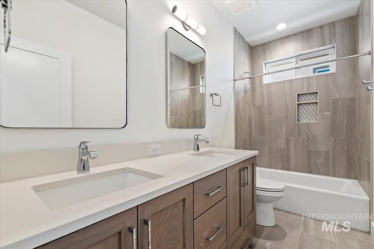 Bathroom featuring  shower combination and a sink