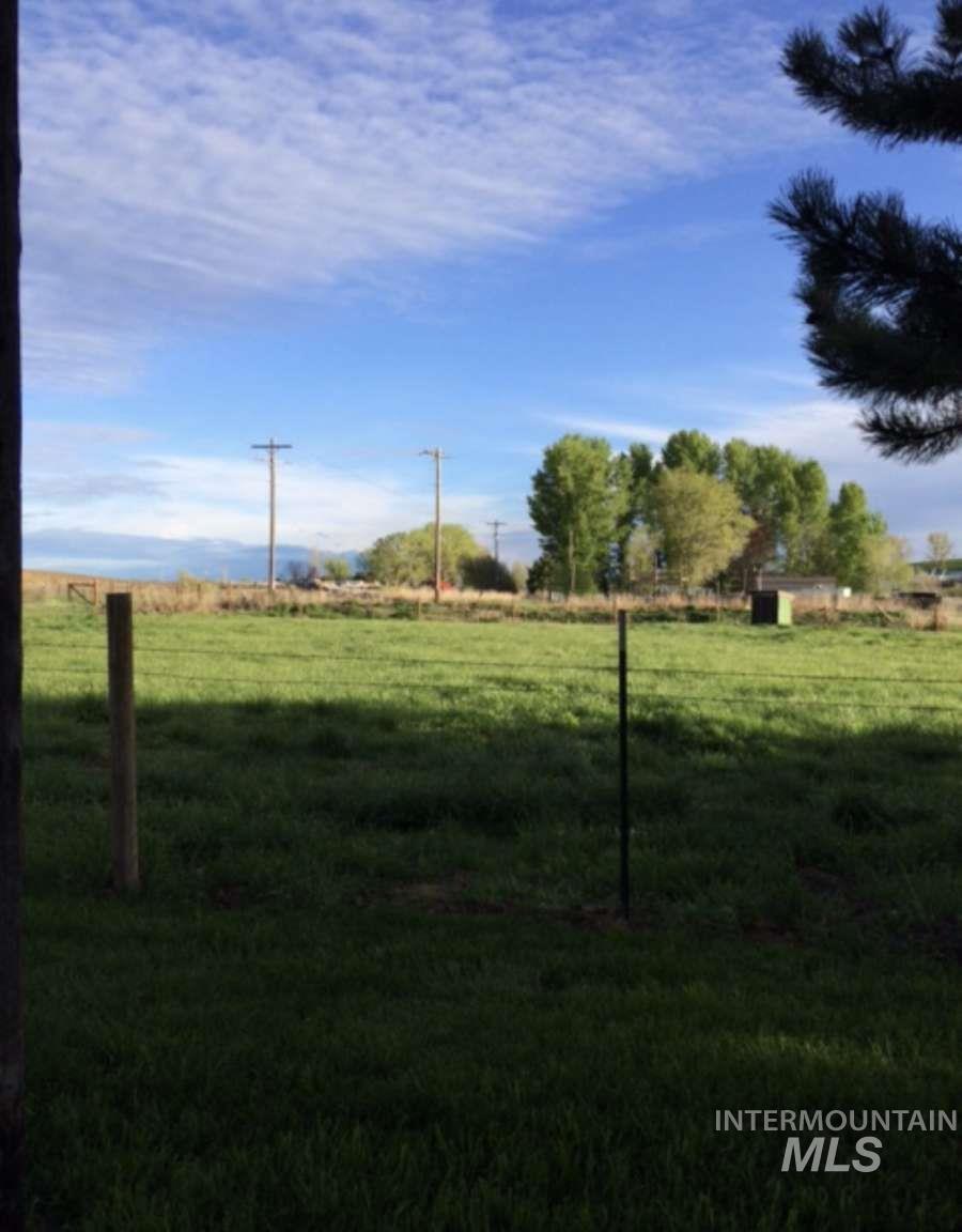 View of green lawn featuring a rural view