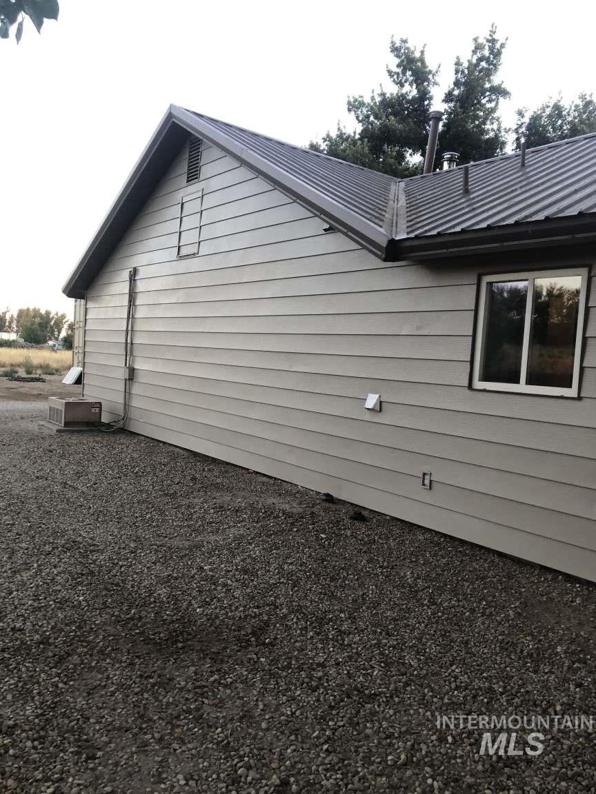 View of home's exterior with a metal roof