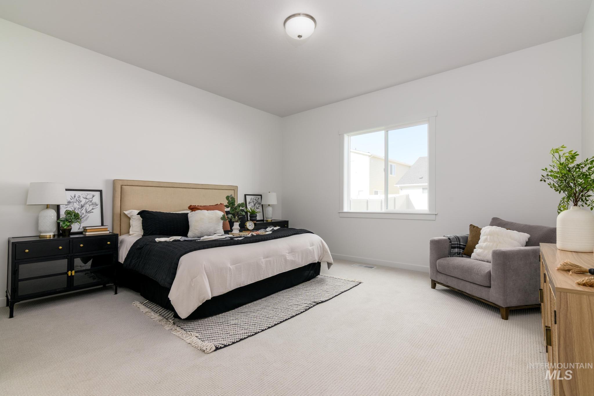 Bedroom with carpet and baseboards