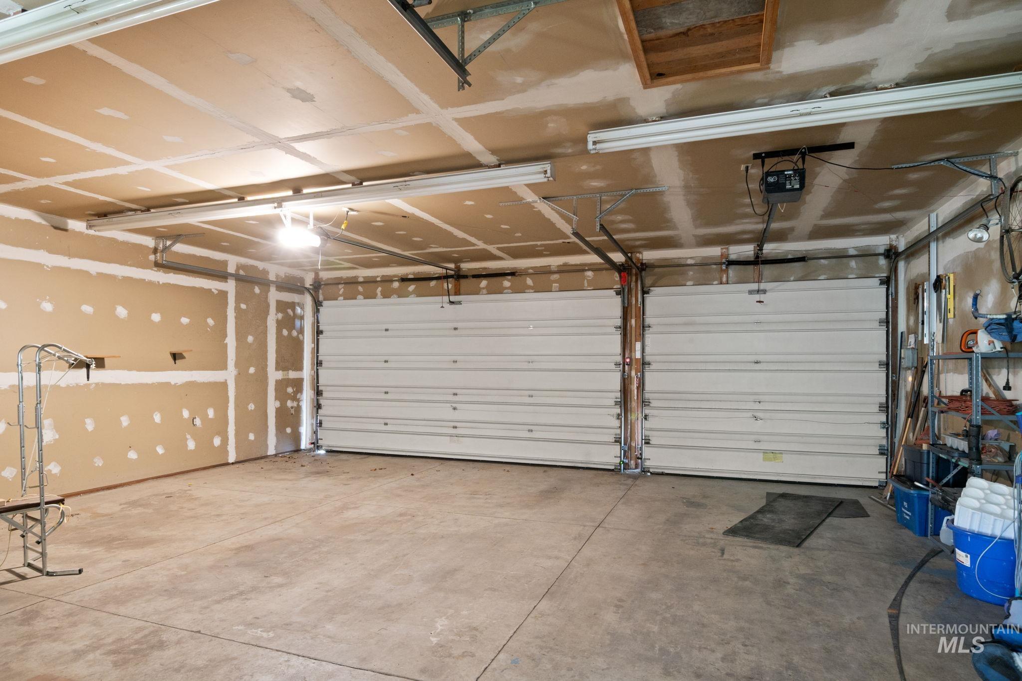 Garage featuring a garage door opener