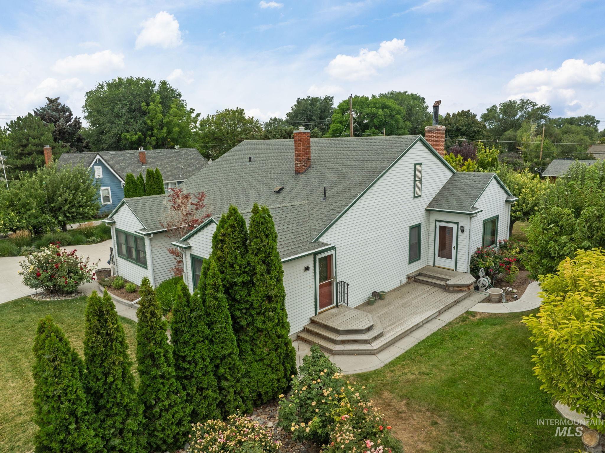 View from above of property featuring a tree filled landscape