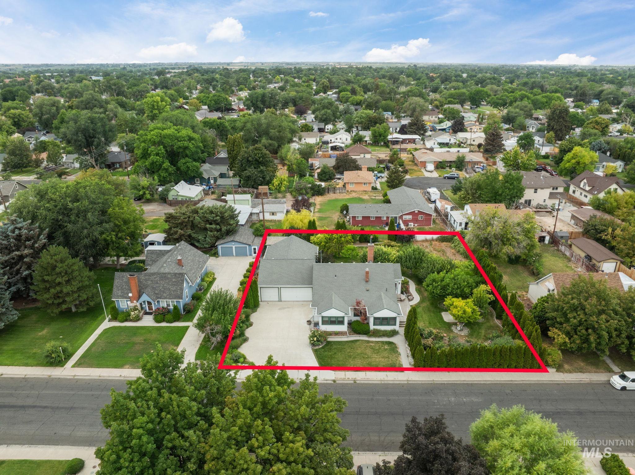 Aerial perspective of suburban area featuring property parcel outlined