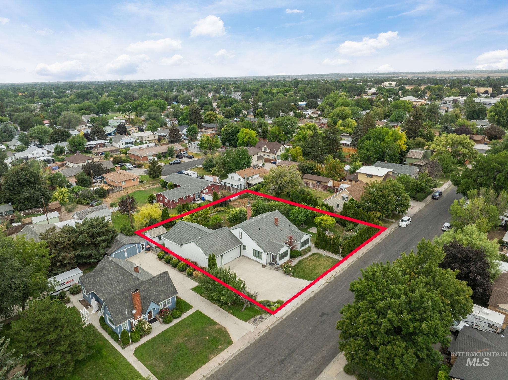 Aerial perspective of suburban area with property boundaries highlighted