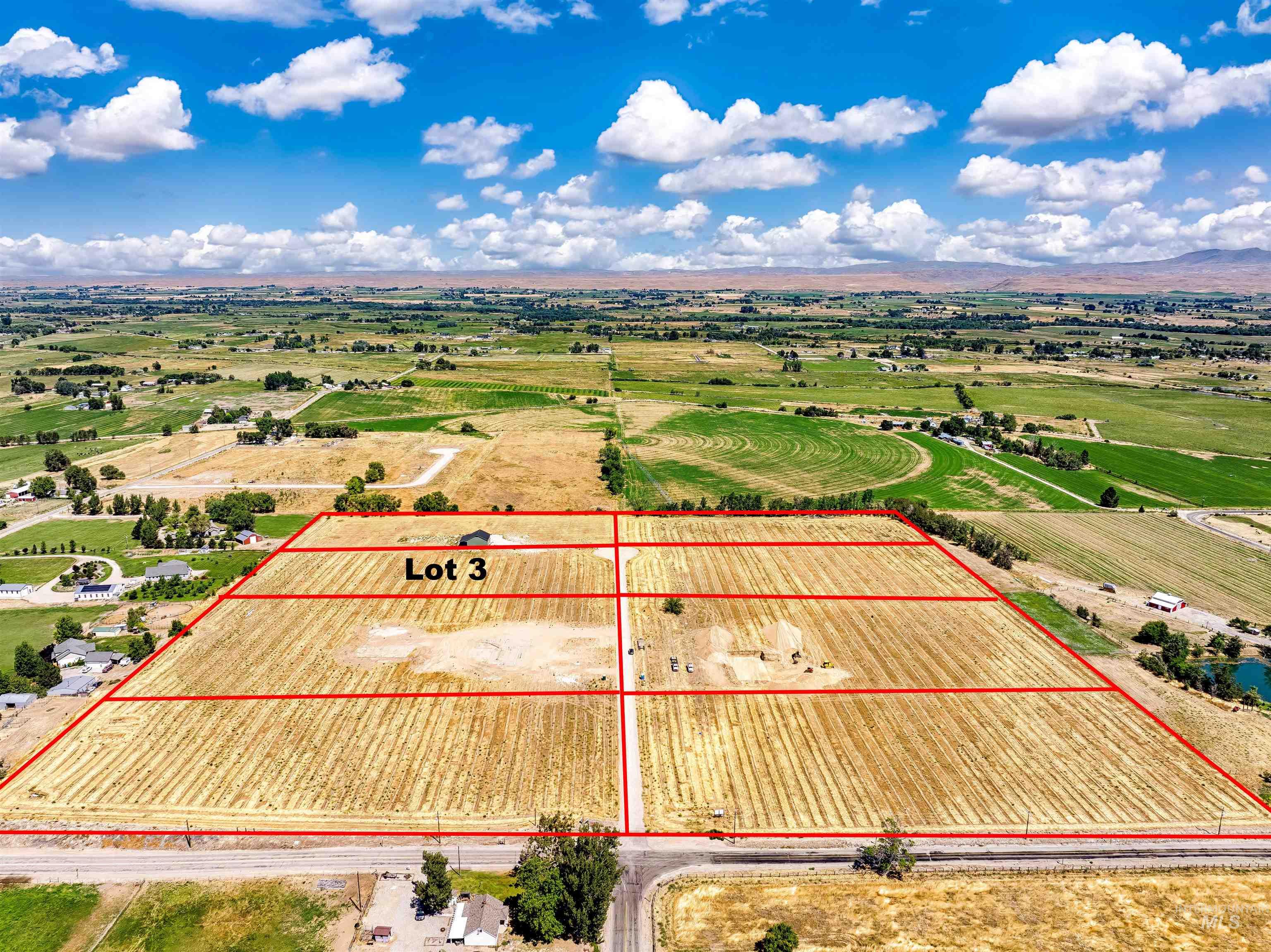 Aerial view of sparsely populated area featuring property boundaries highlighted and abundant farmland