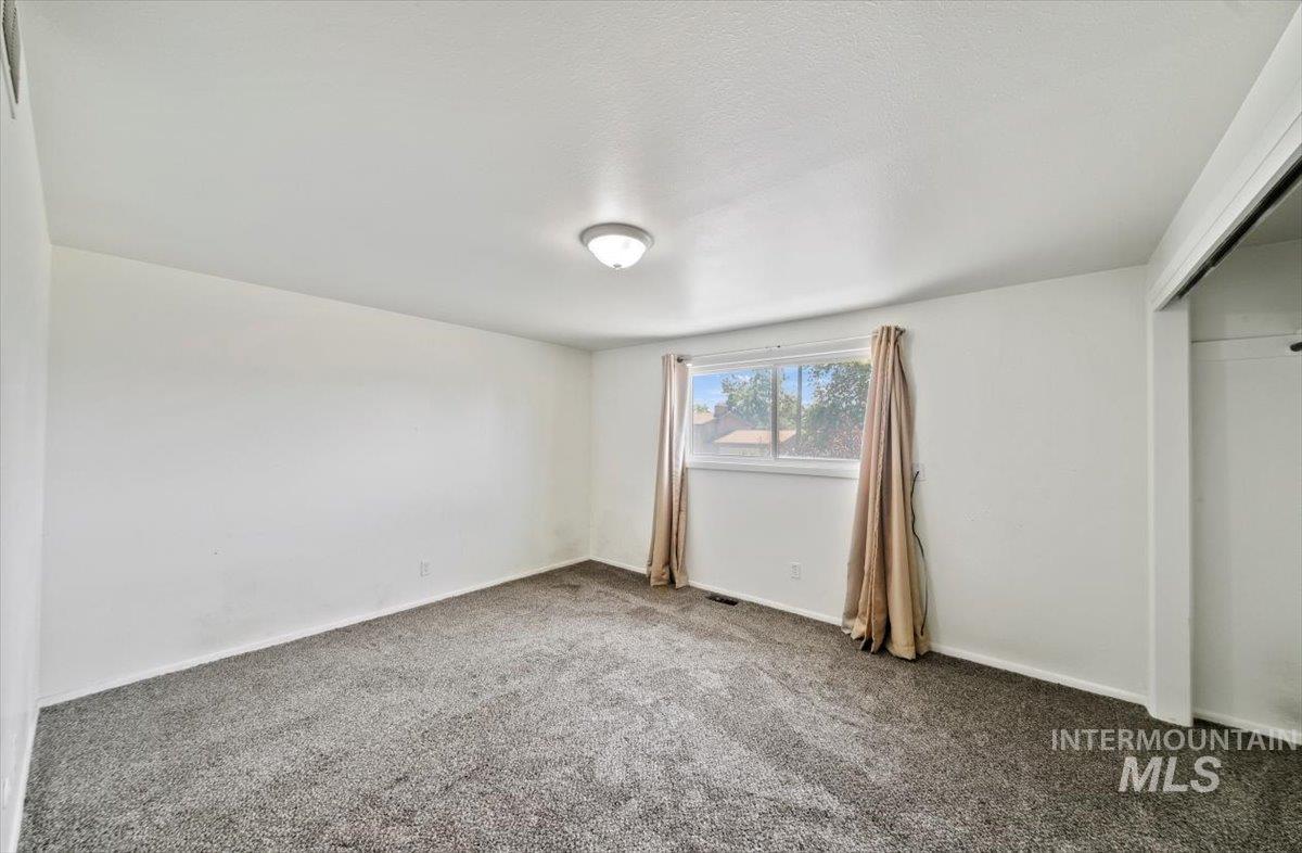 Unfurnished bedroom with carpet floors and a closet