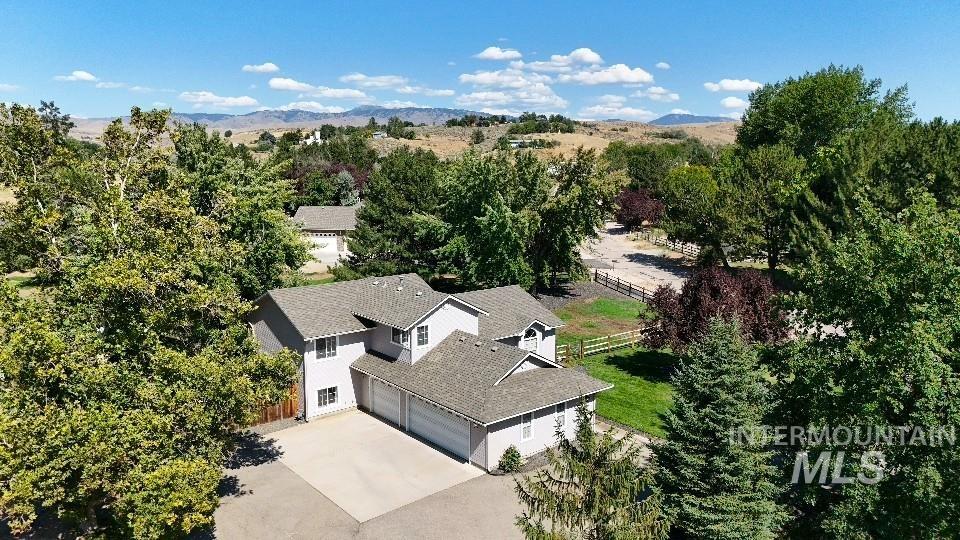 View from above of property featuring a mountainous background