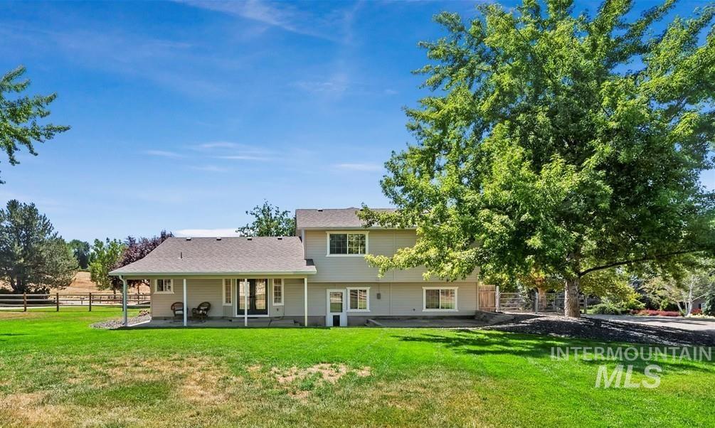 Back of property with a patio