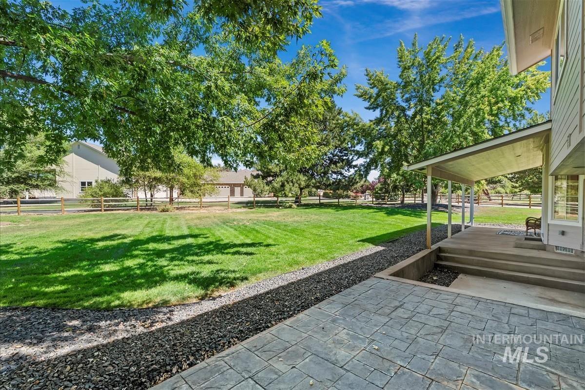 Fenced backyard with a patio