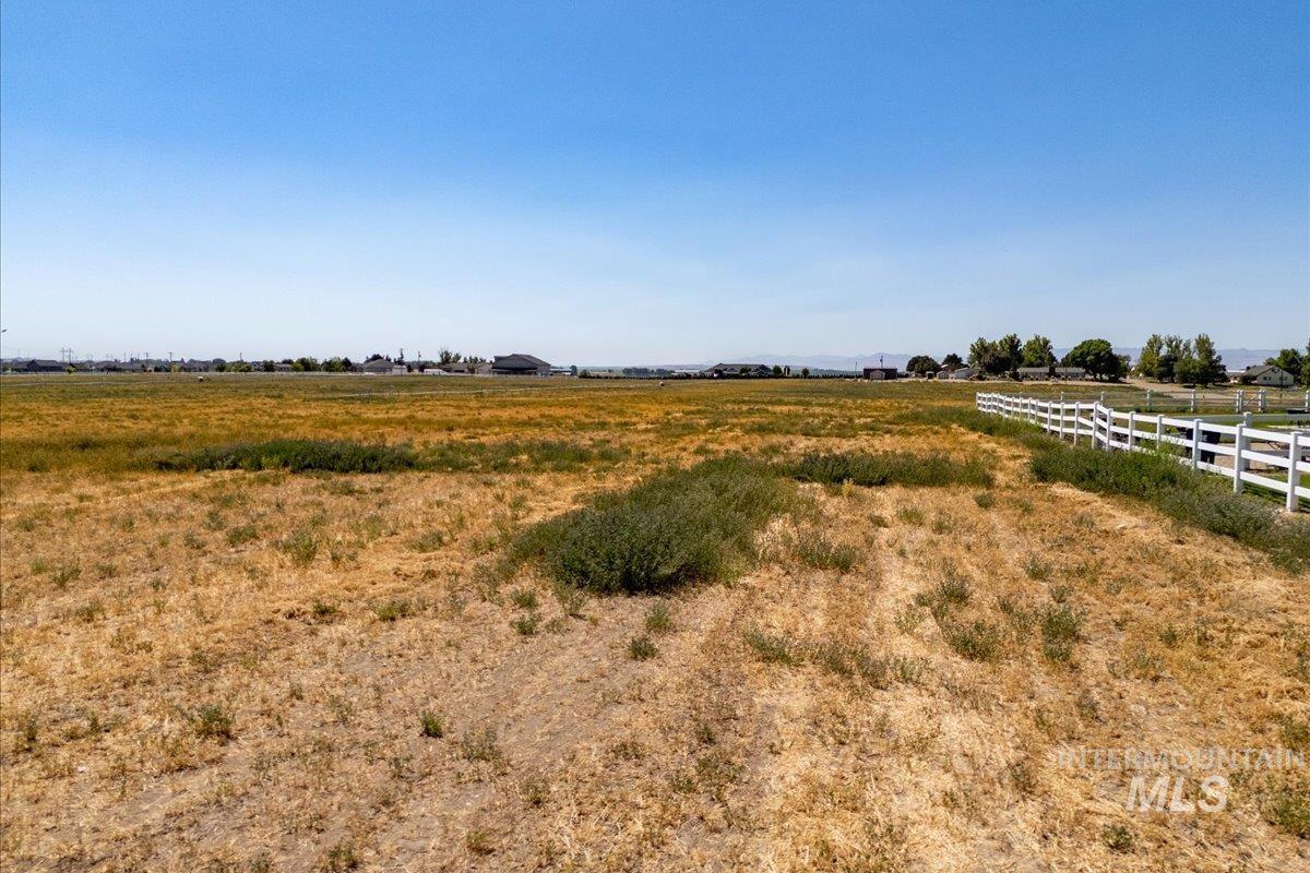 View of yard with a rural view