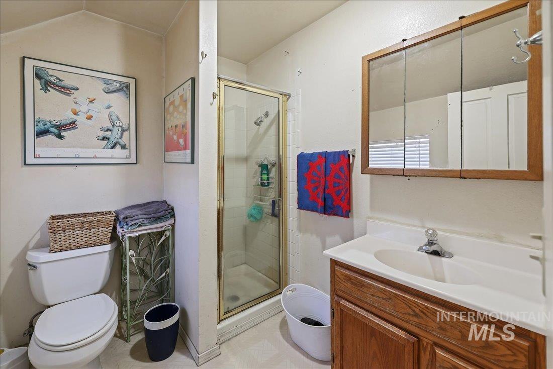Full bath with vanity and a stall shower