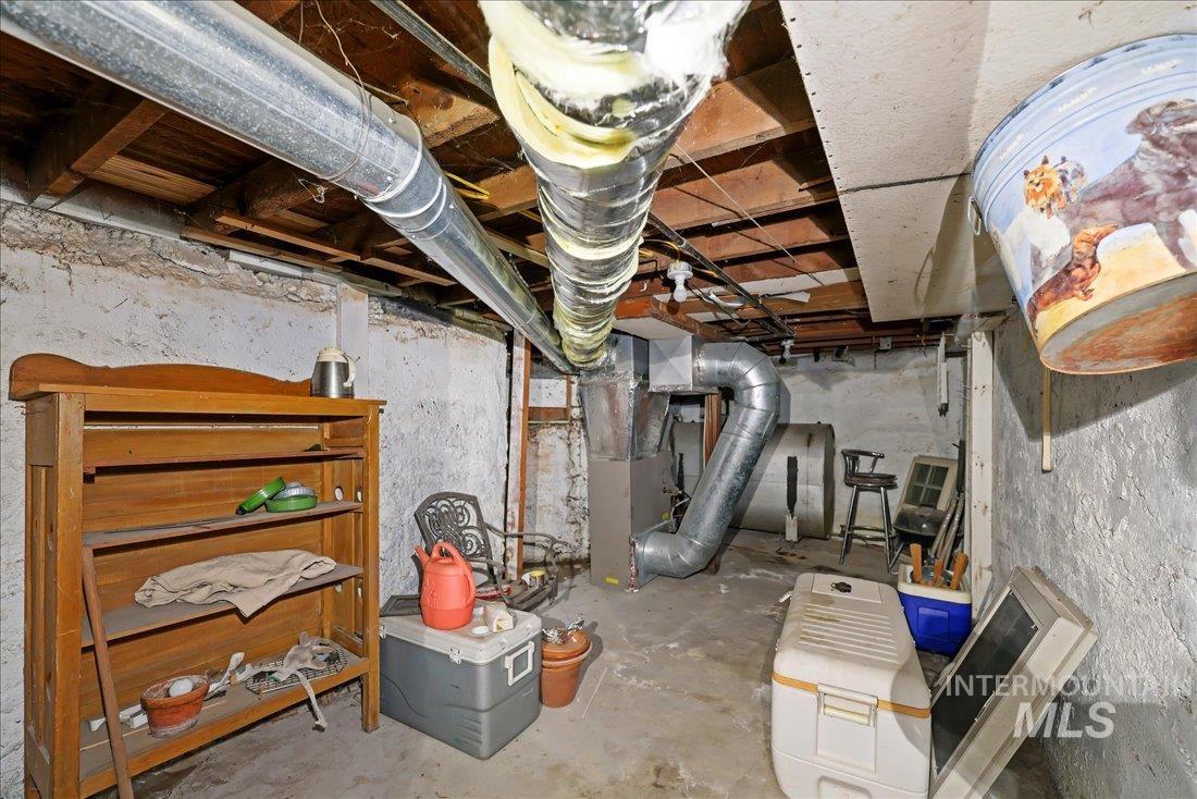 Unfinished below grade area with heating unit