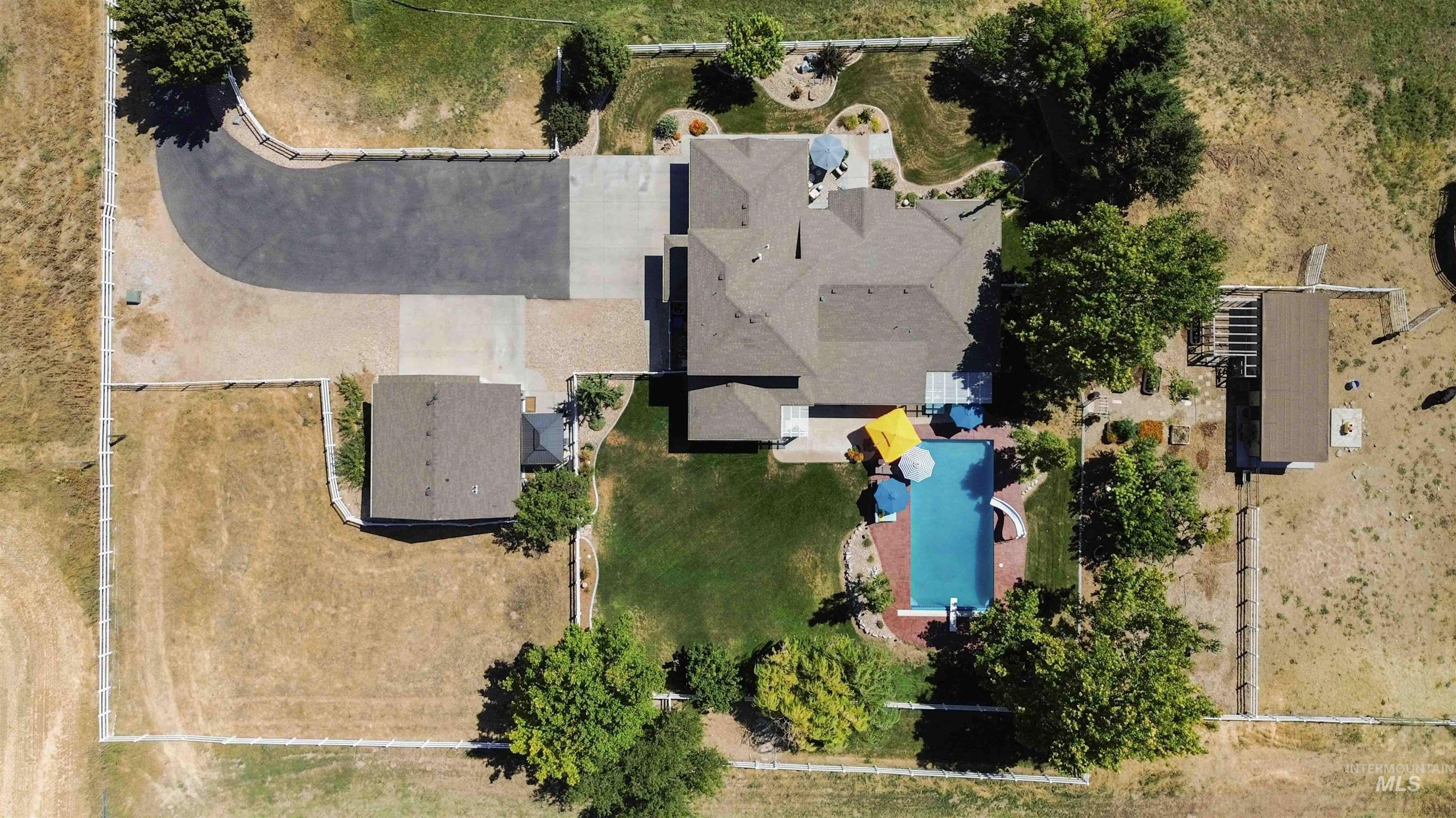 Aerial view of property's location featuring a pool