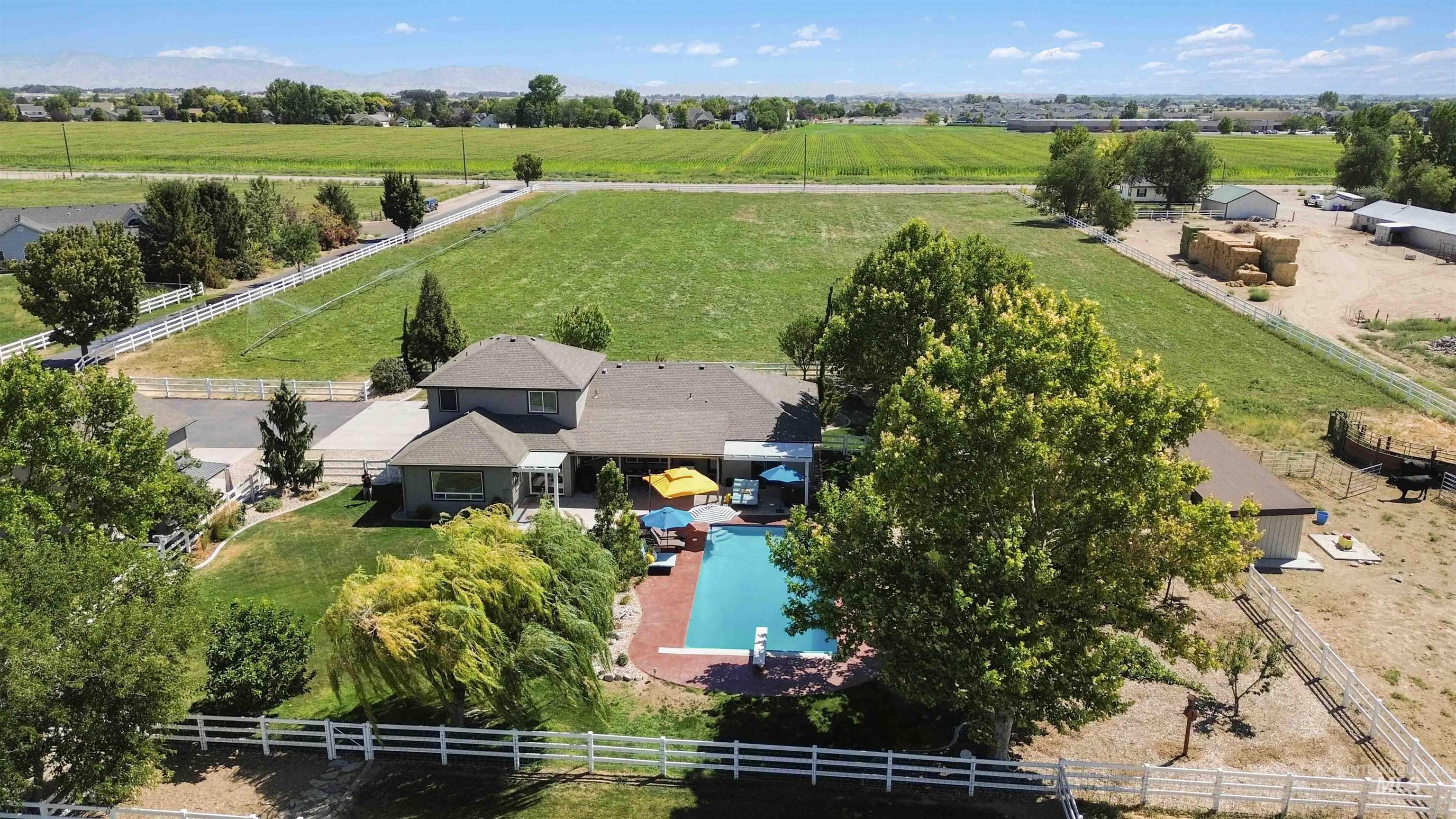 Overview of rural landscape with a pastoral area and a pool area