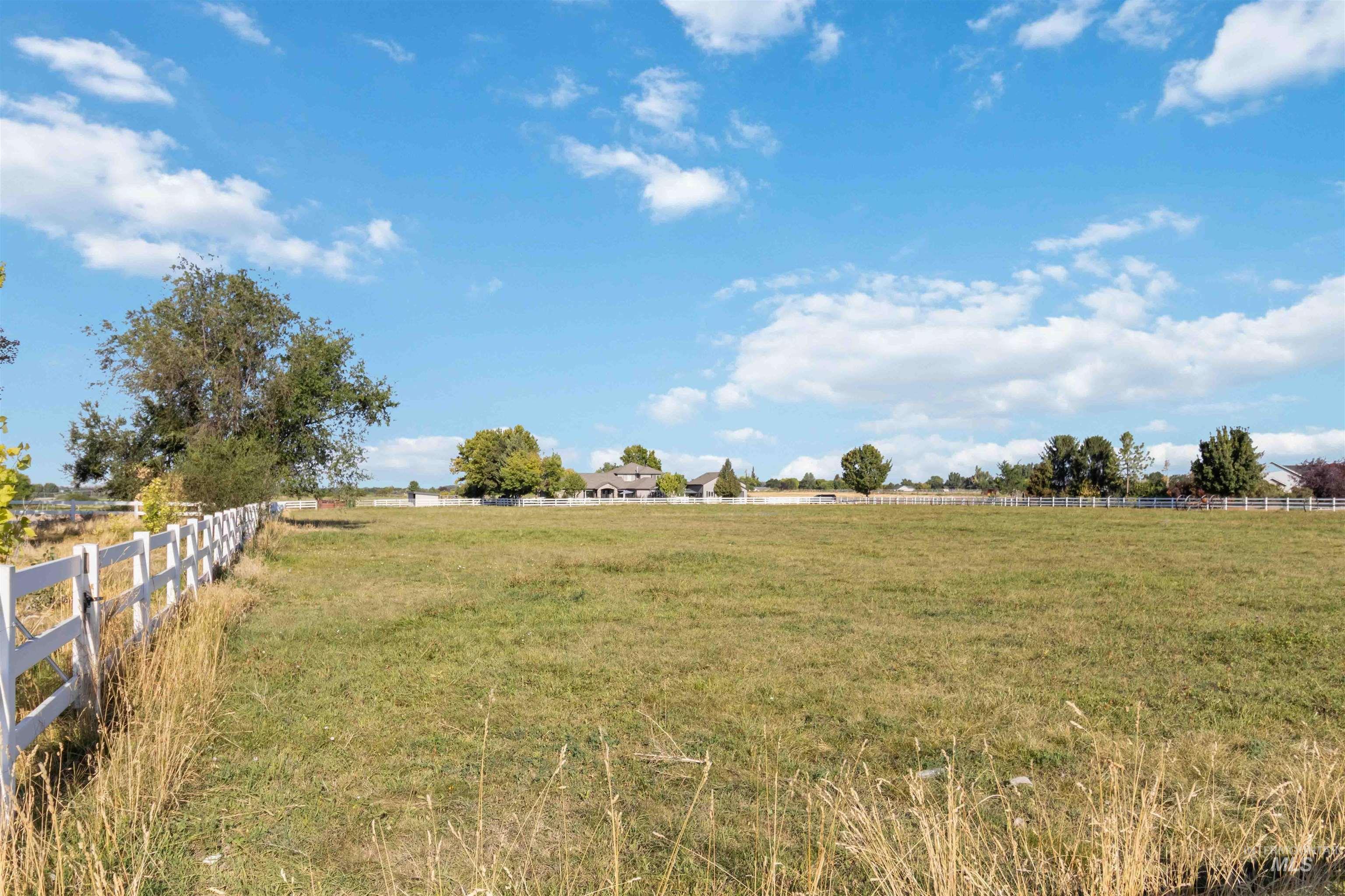 View of yard with a rural view