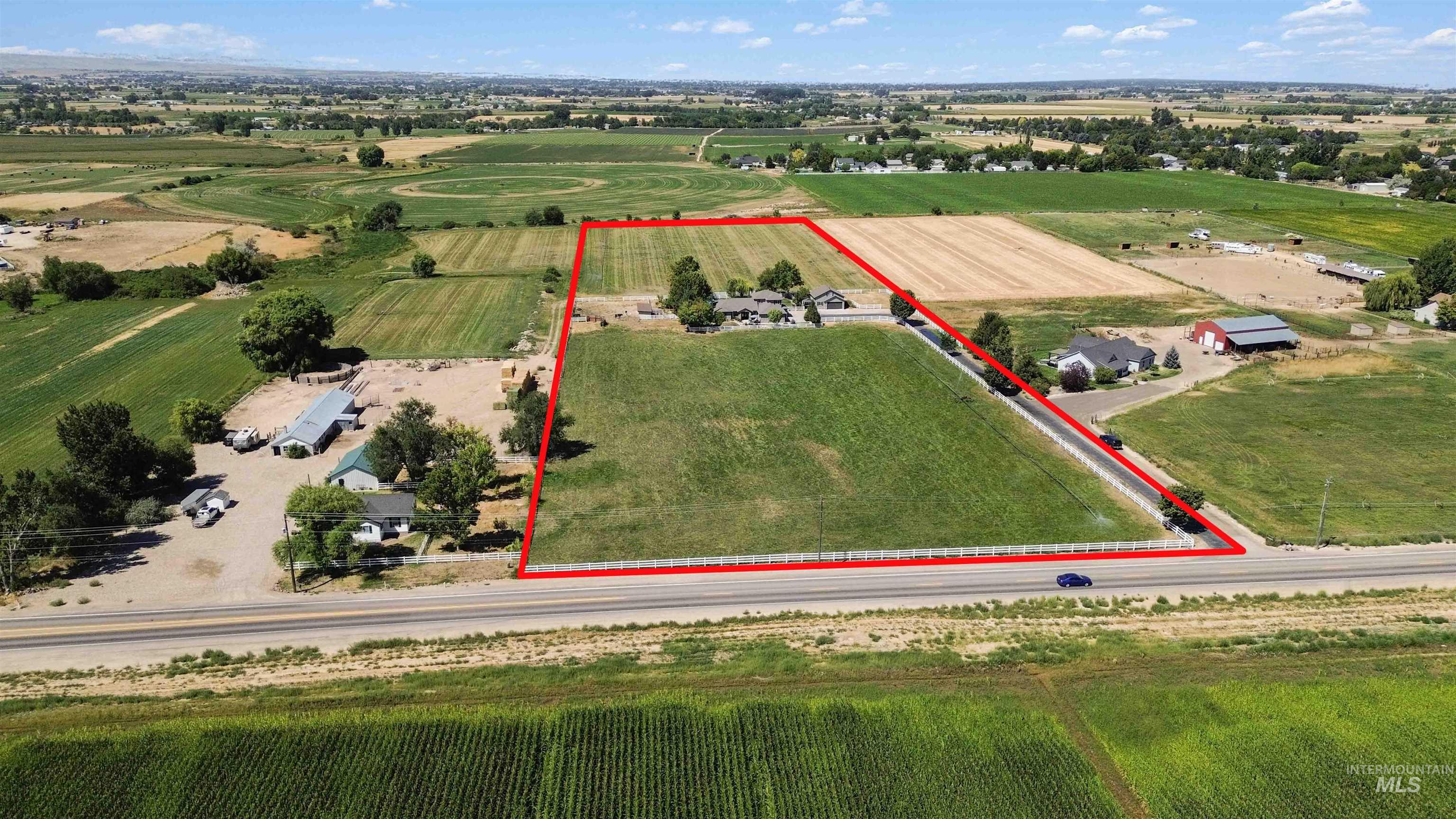 Overview of rural landscape with extensive farmland and property parcel outlined