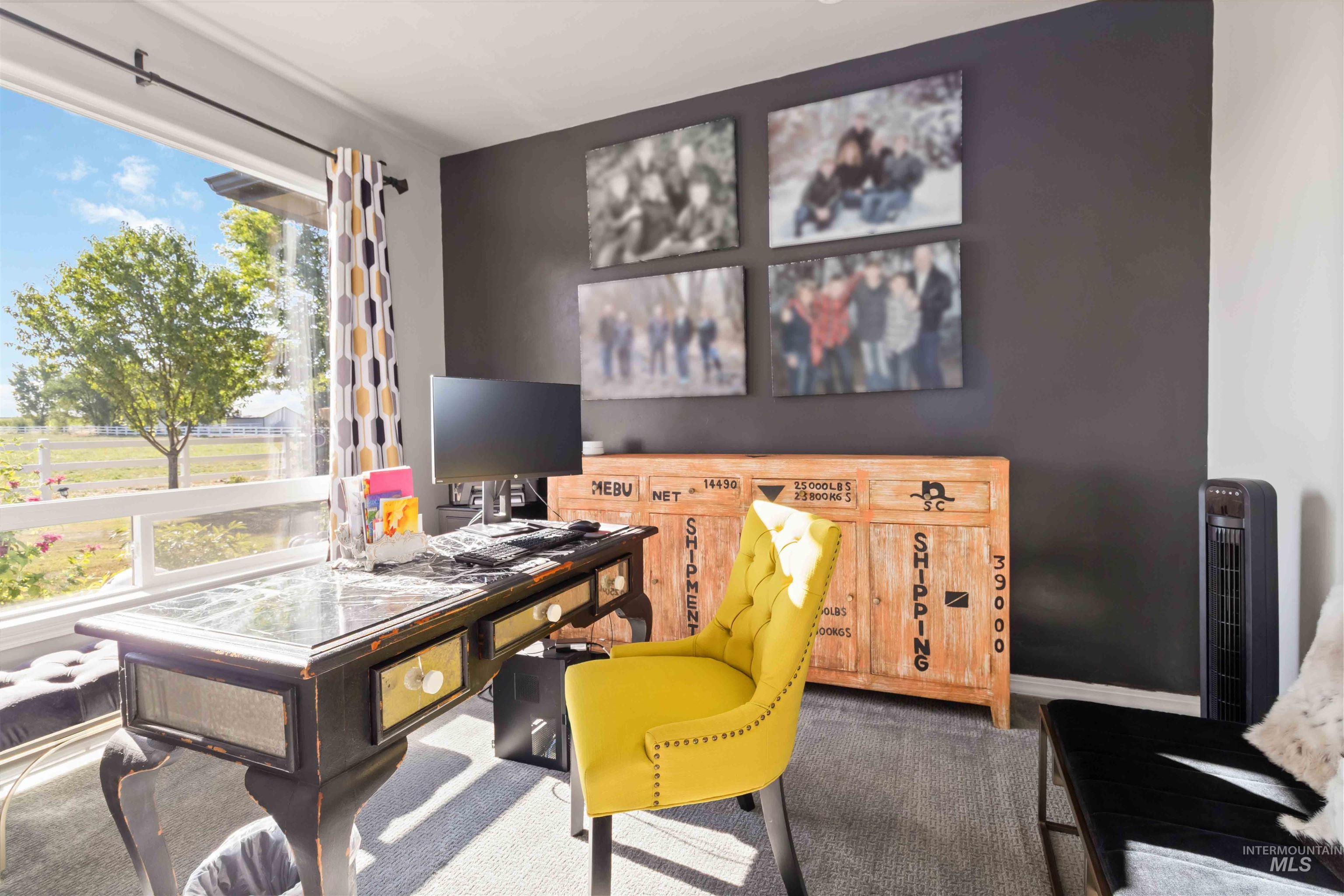 Home office with carpet floors and baseboards