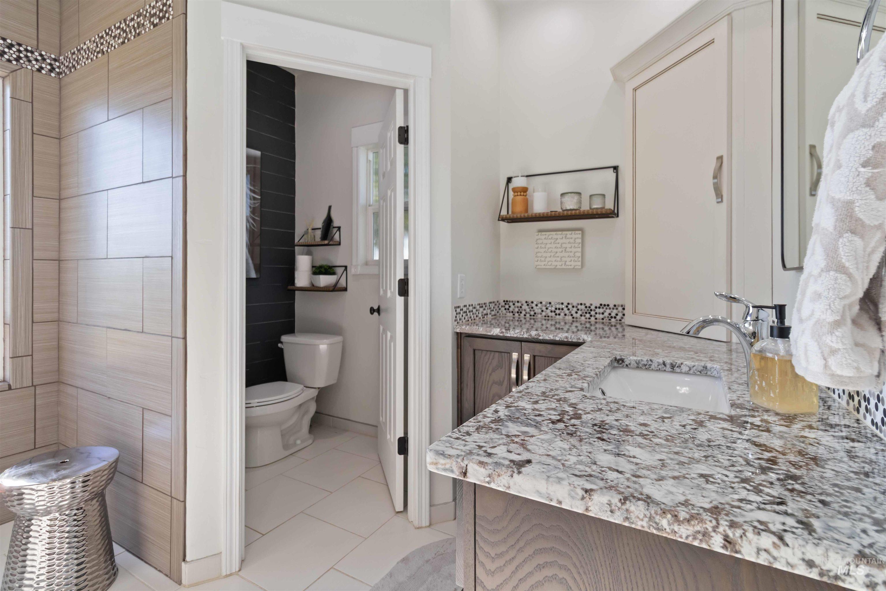Bathroom with vanity and light tile patterned floors