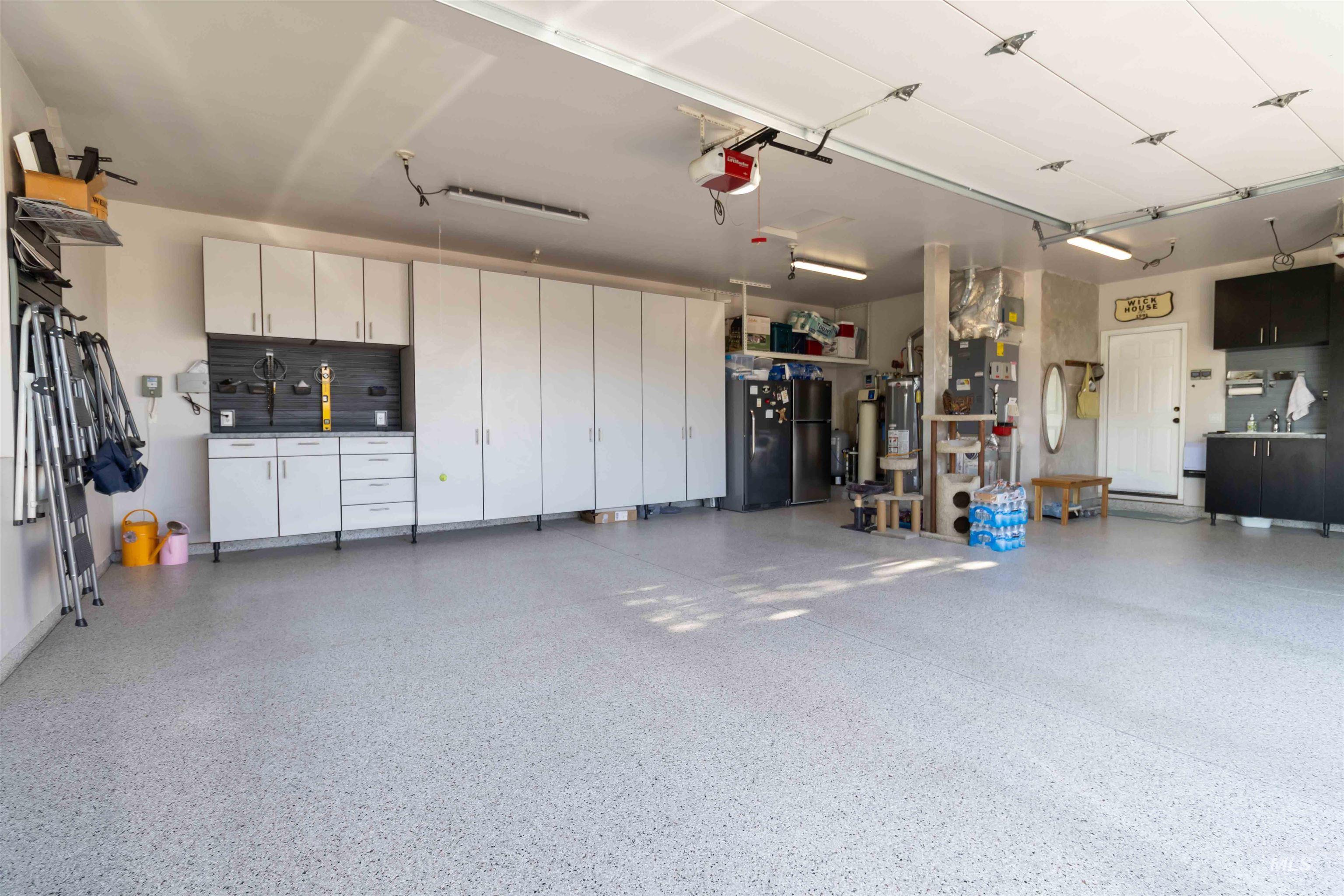 Garage featuring a garage door opener