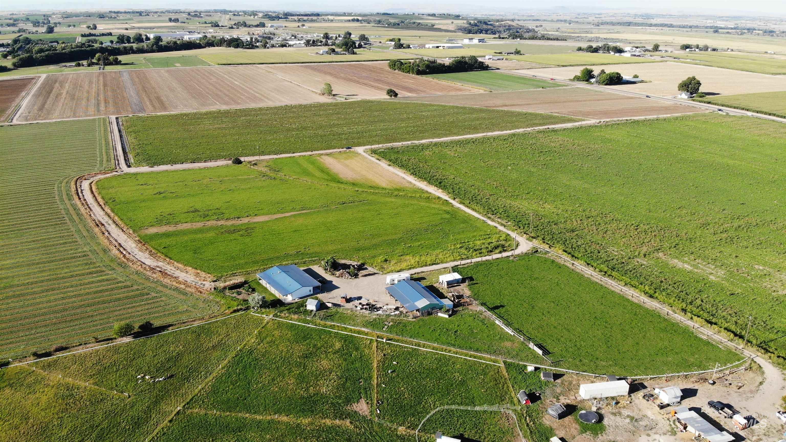 Aerial view of sparsely populated area featuring extensive farmland