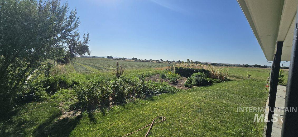View of grassy yard with a view of countryside