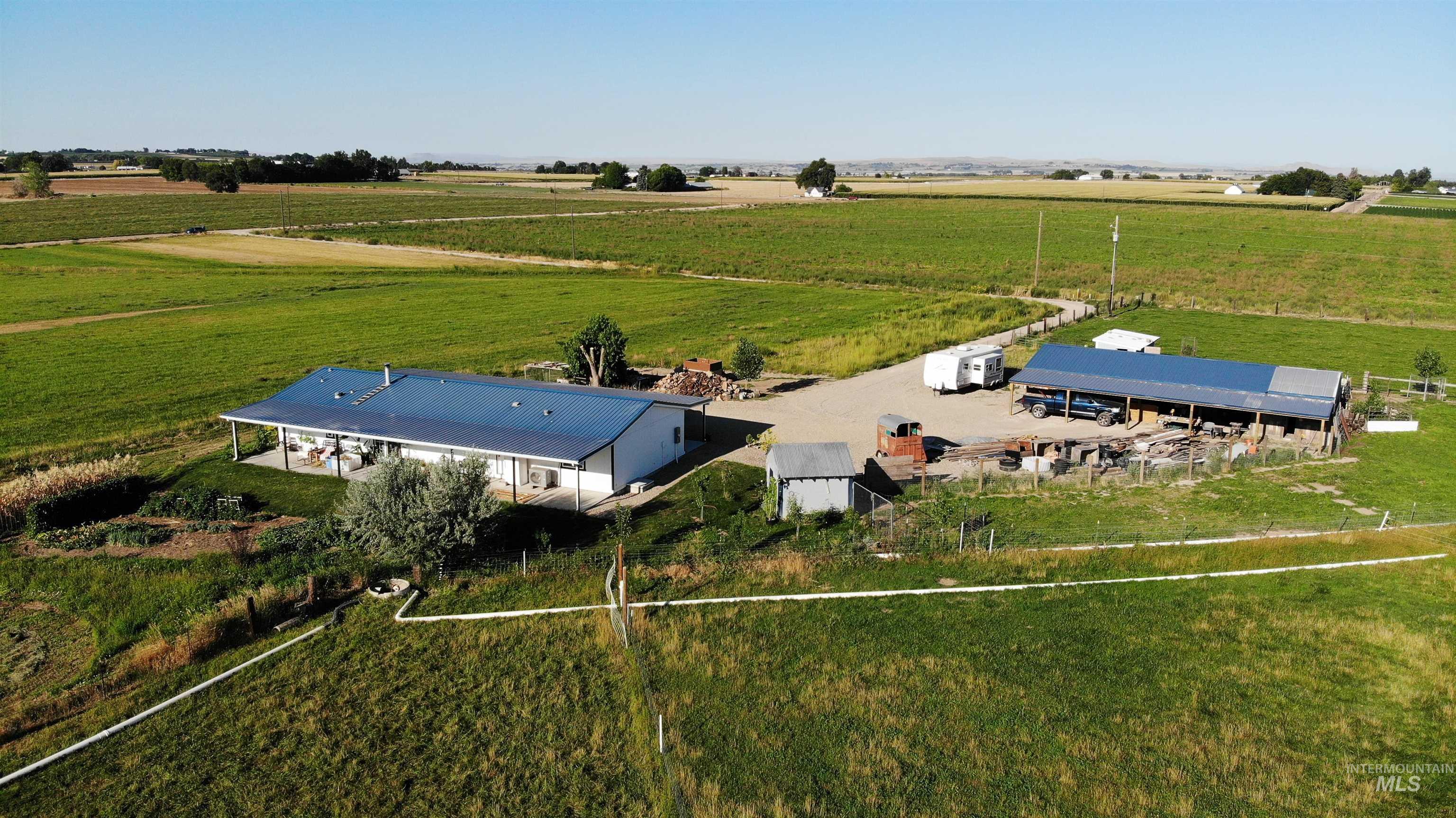 Aerial view of sparsely populated area featuring farmland