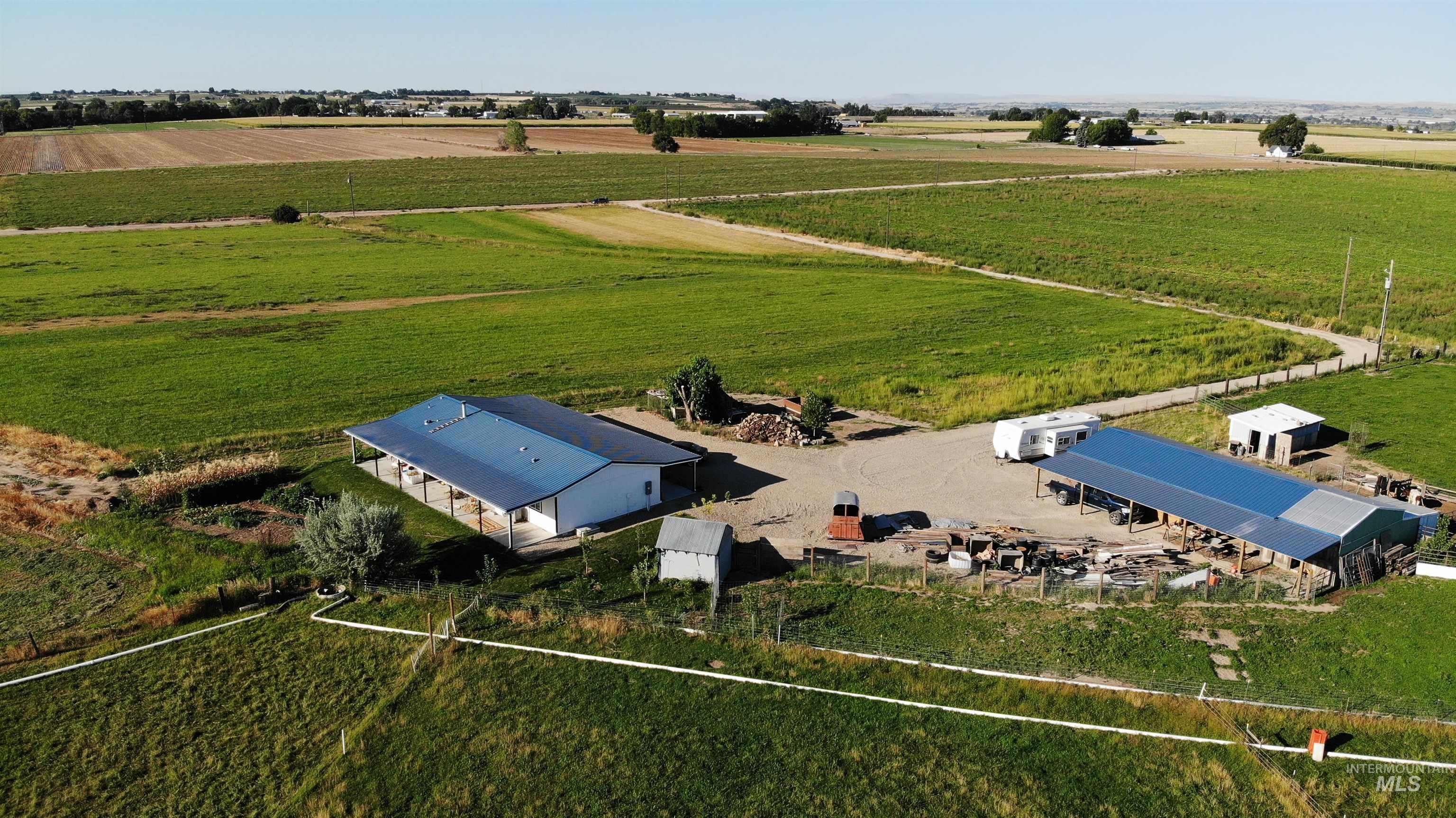 View of rural area featuring rows of crops