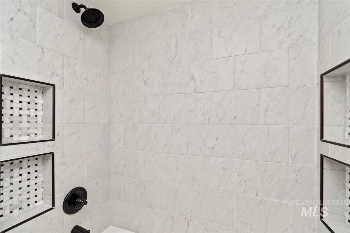 Bathroom view of bathing tub / shower combination