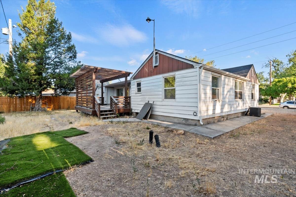 Rear view of property with board and batten siding