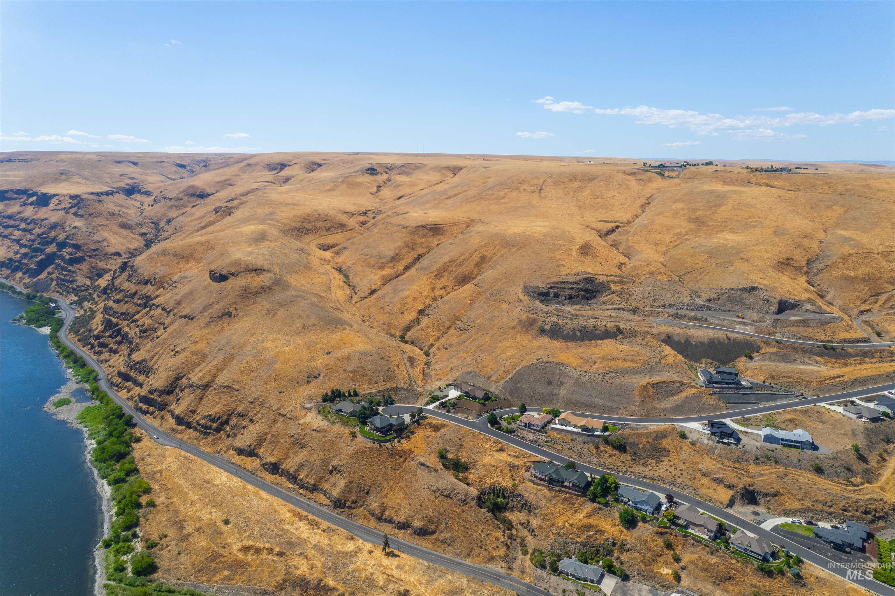 Aerial view of property's location with a nearby body of water and rural landscape