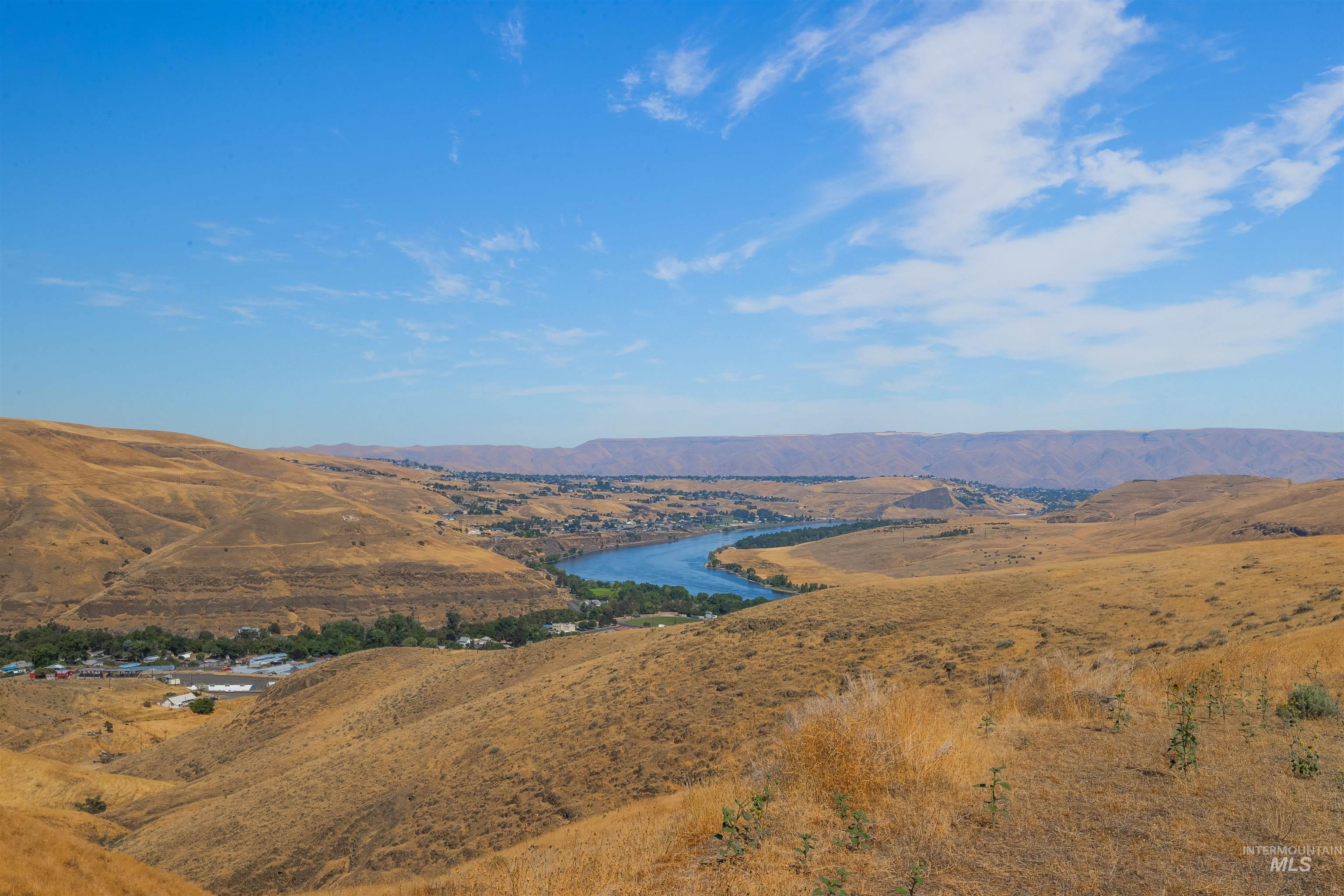 View of mountain backdrop featuring a large body of water