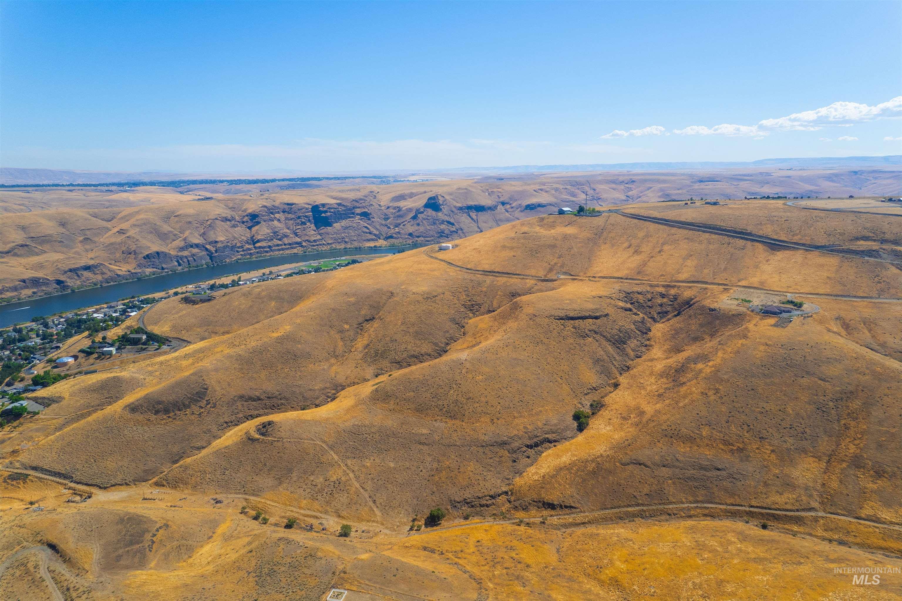 Overview of rural landscape featuring a mountain backdrop