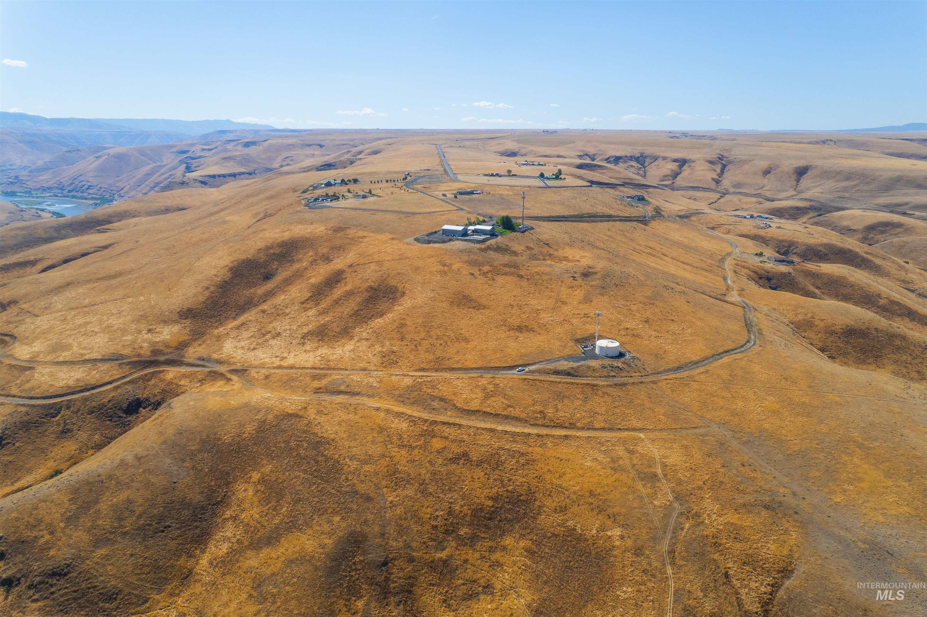 Overview of rural landscape featuring a mountain backdrop
