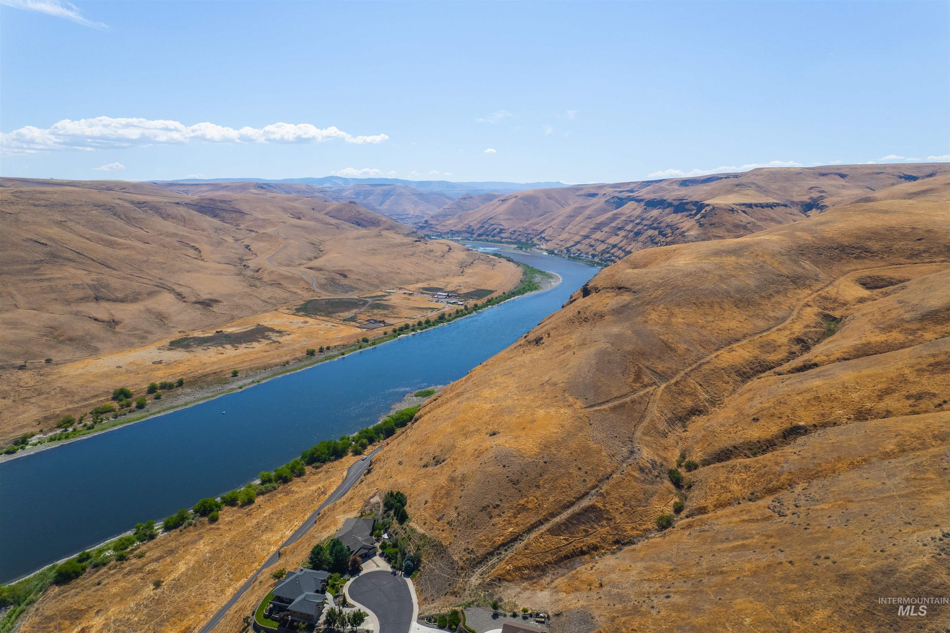 Aerial overview of property's location with a water and mountain view