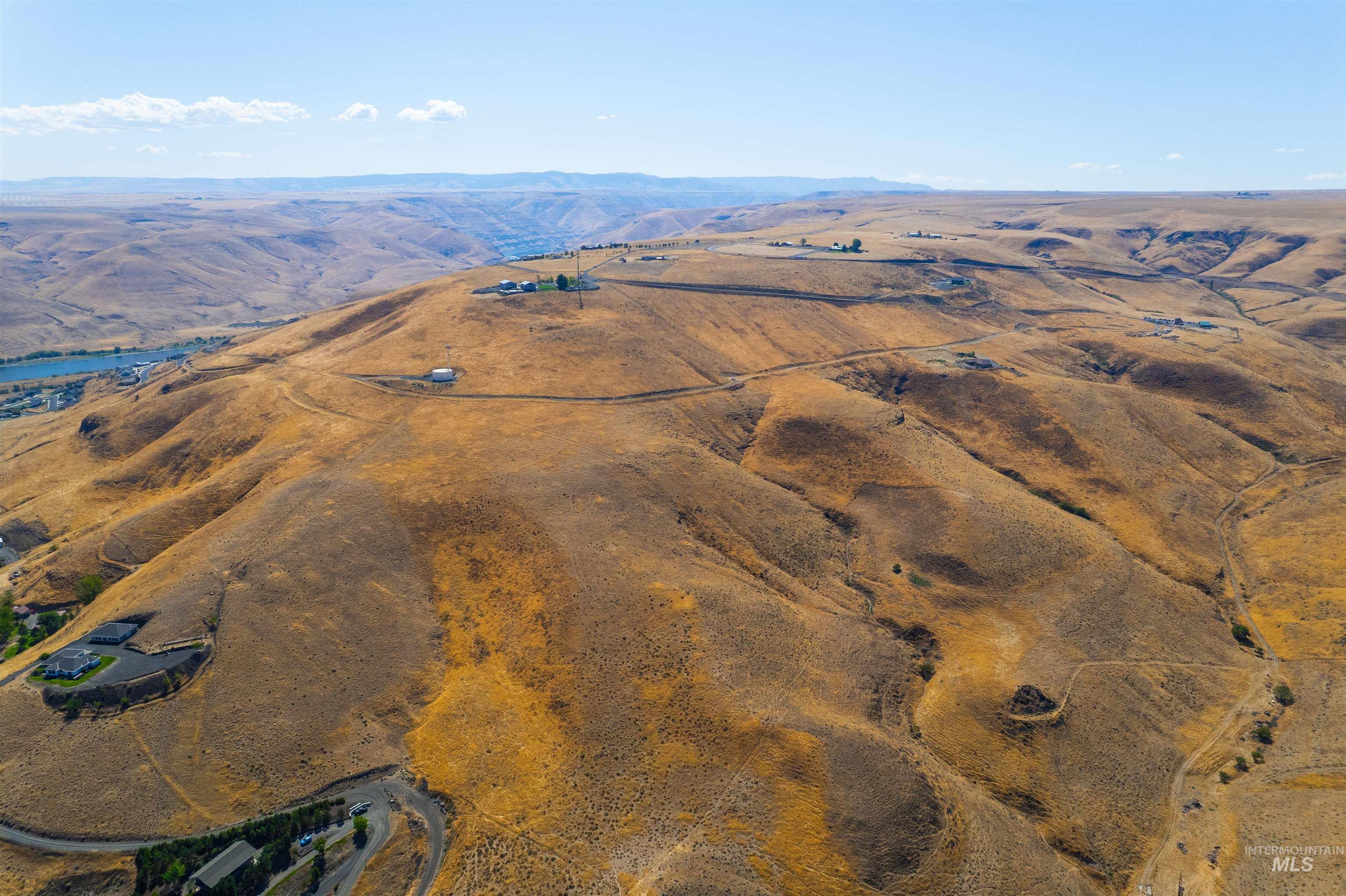 Aerial overview of property's location featuring rural landscape and mountains