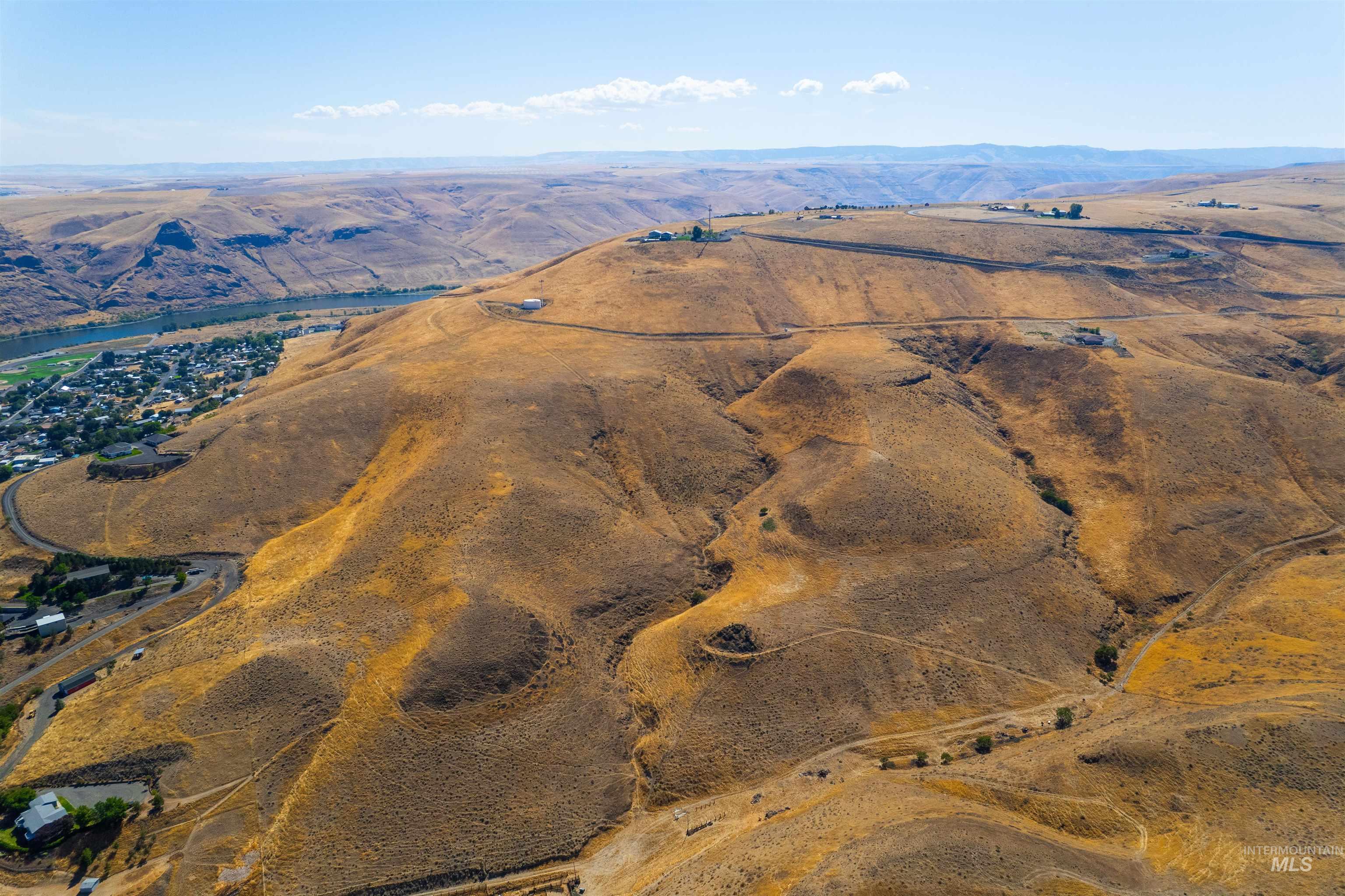 Overview of rural landscape featuring a mountainous background