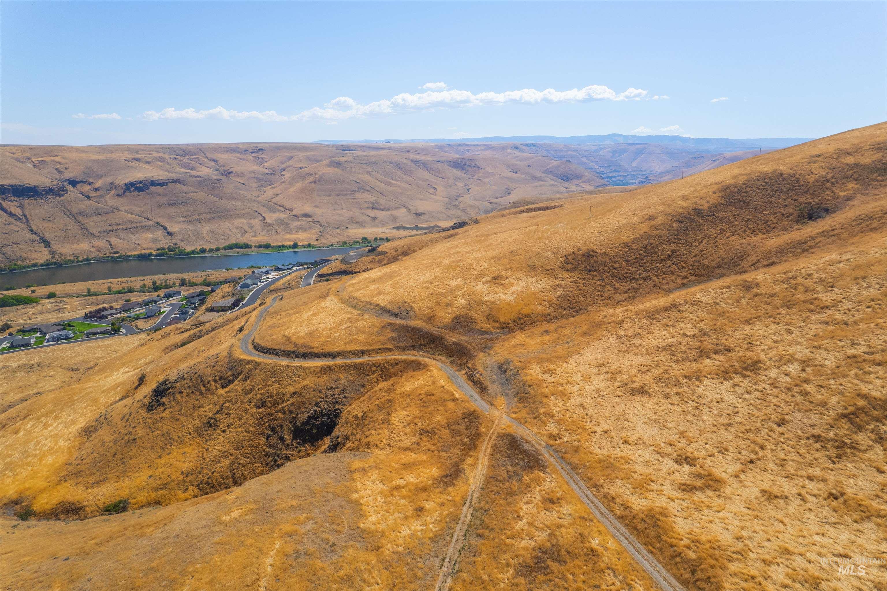 View of property location with a water and mountain view