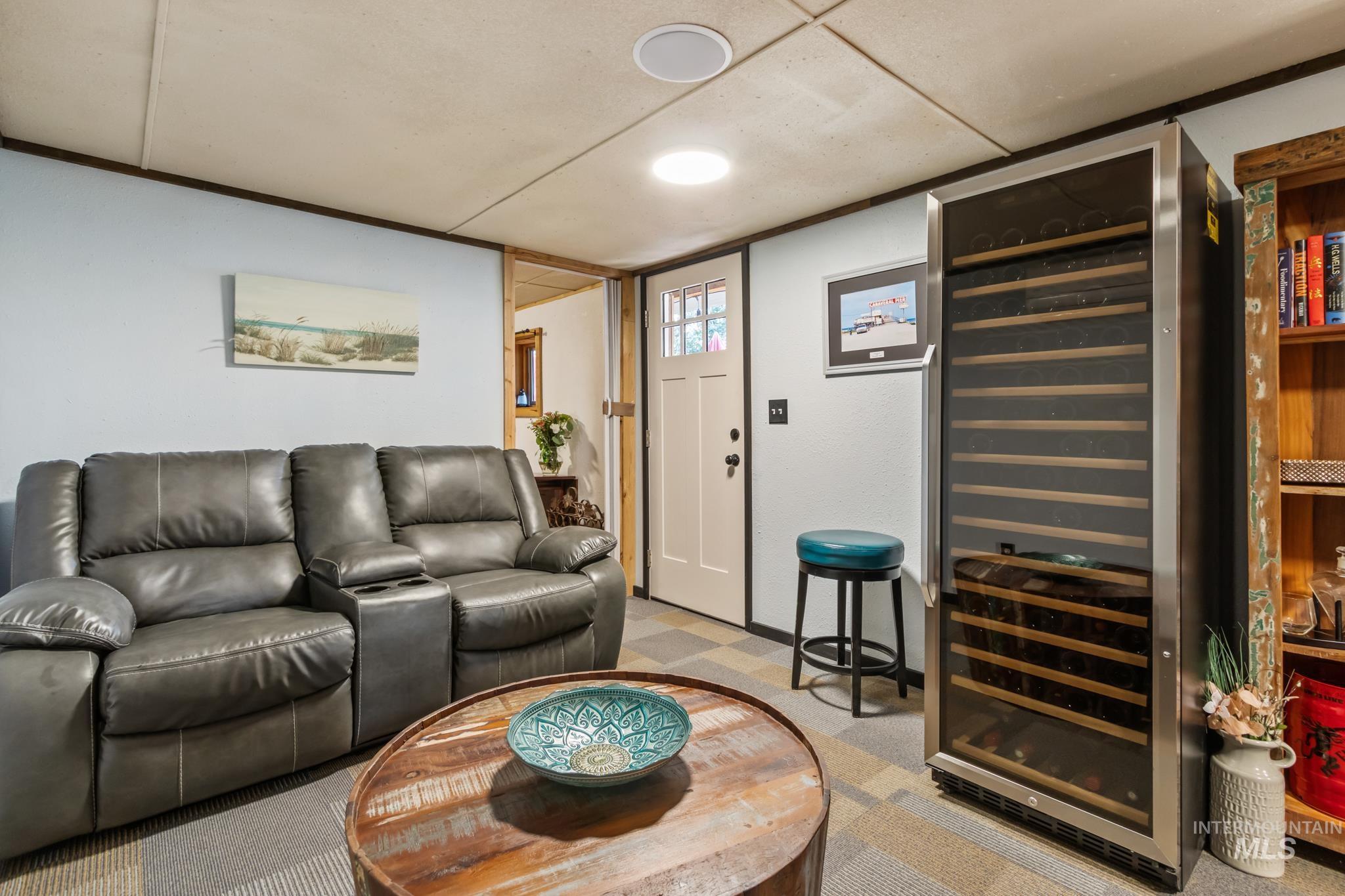 Living area with beverage cooler and light carpet