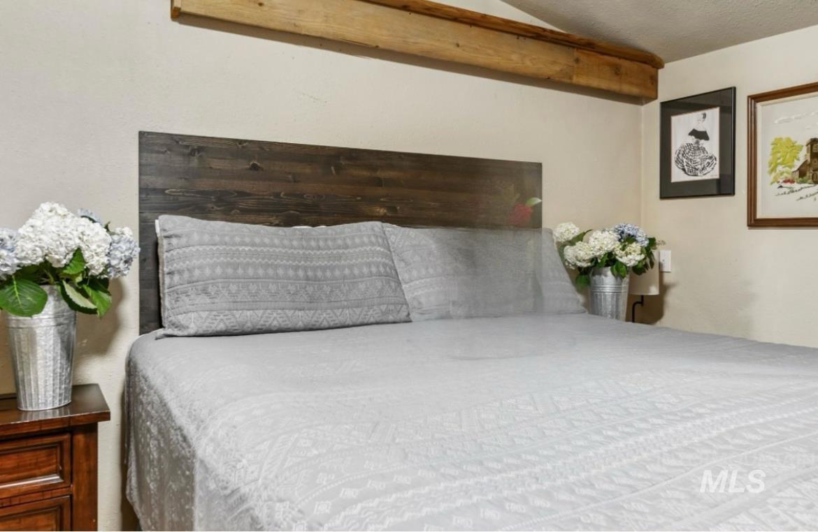 Bedroom with a textured ceiling