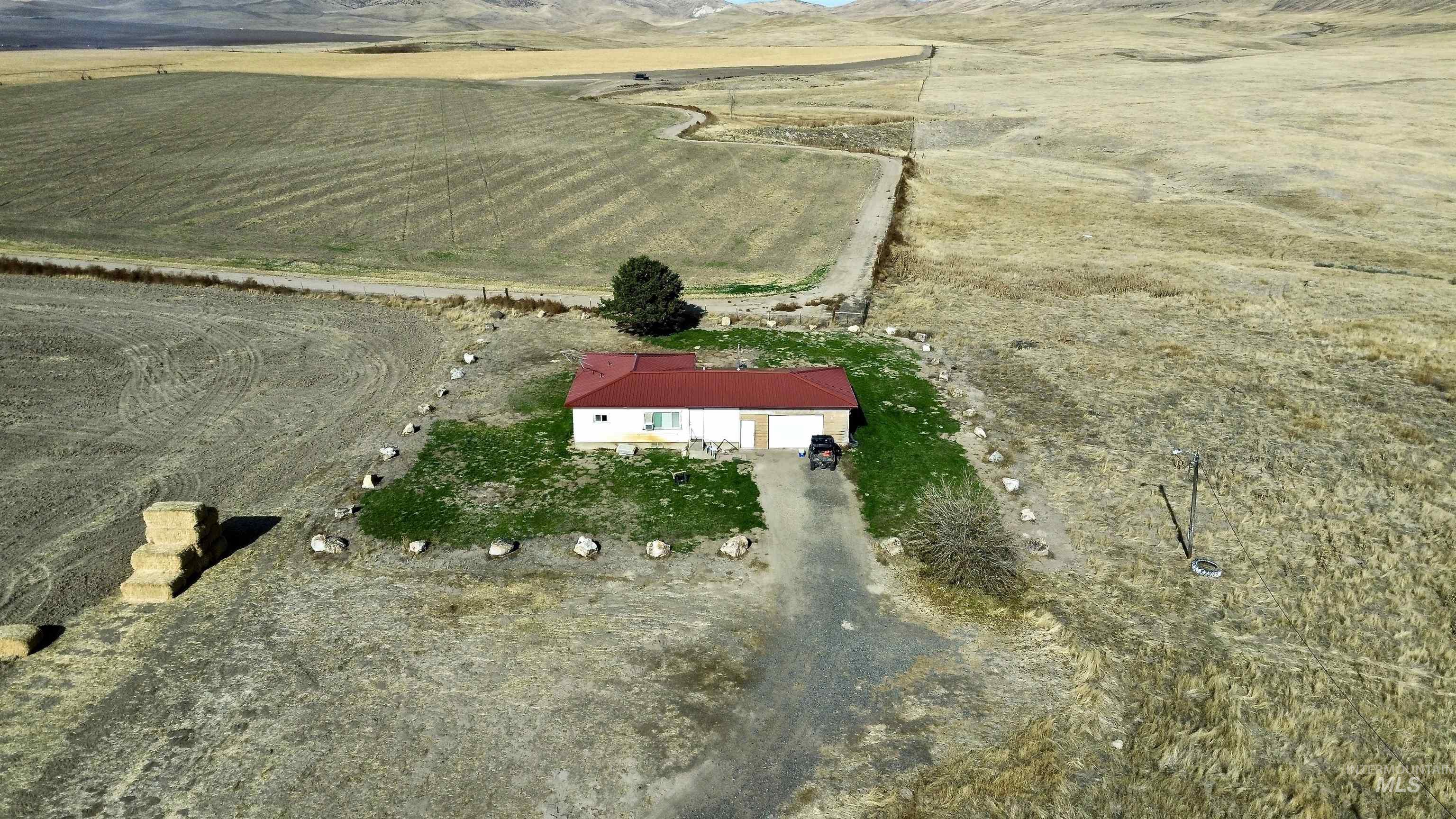 Aerial view of property and surrounding area with rural landscape