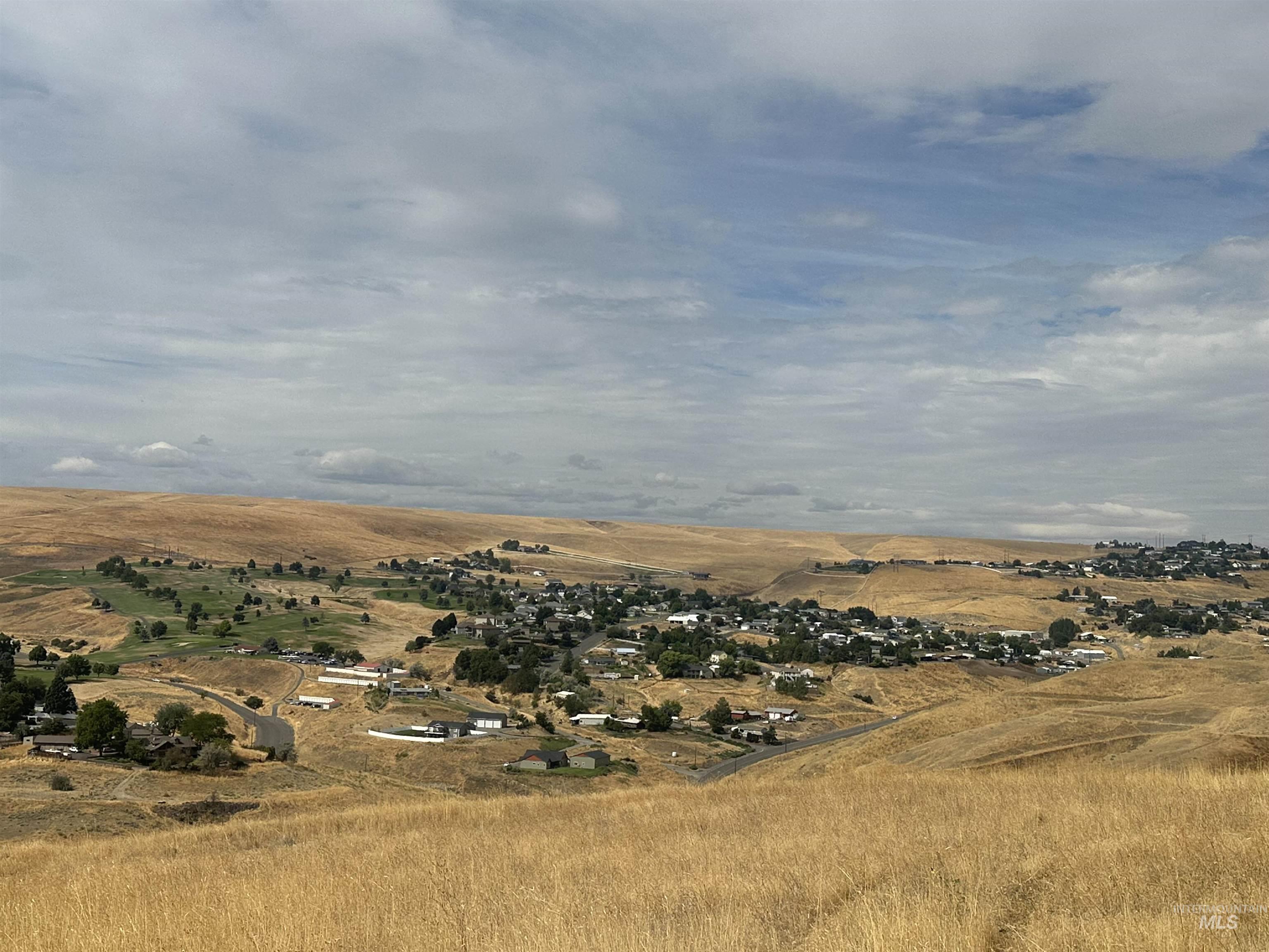 Aerial view of property and surrounding area with rural landscape