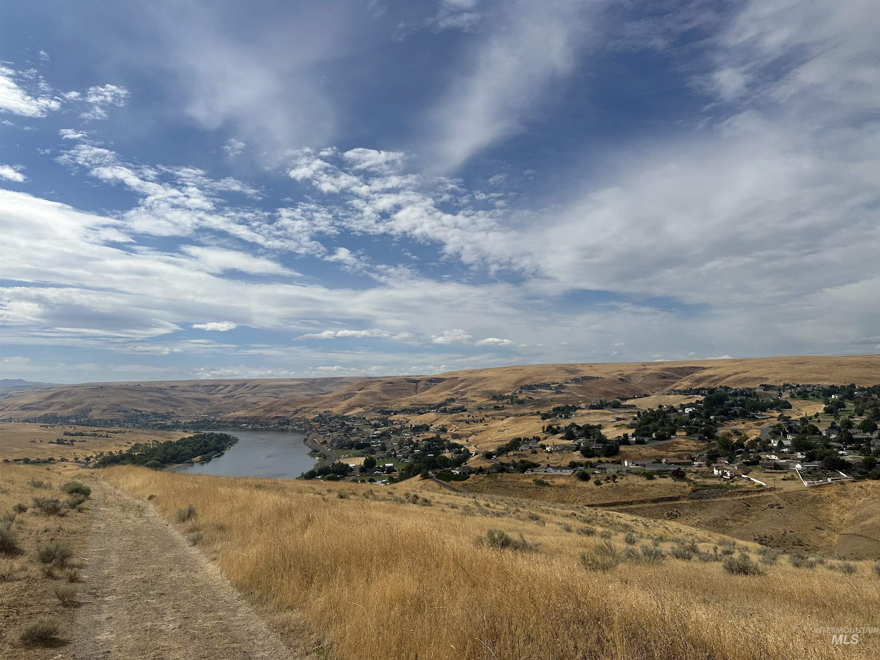 View of mountain backdrop featuring a nearby body of water
