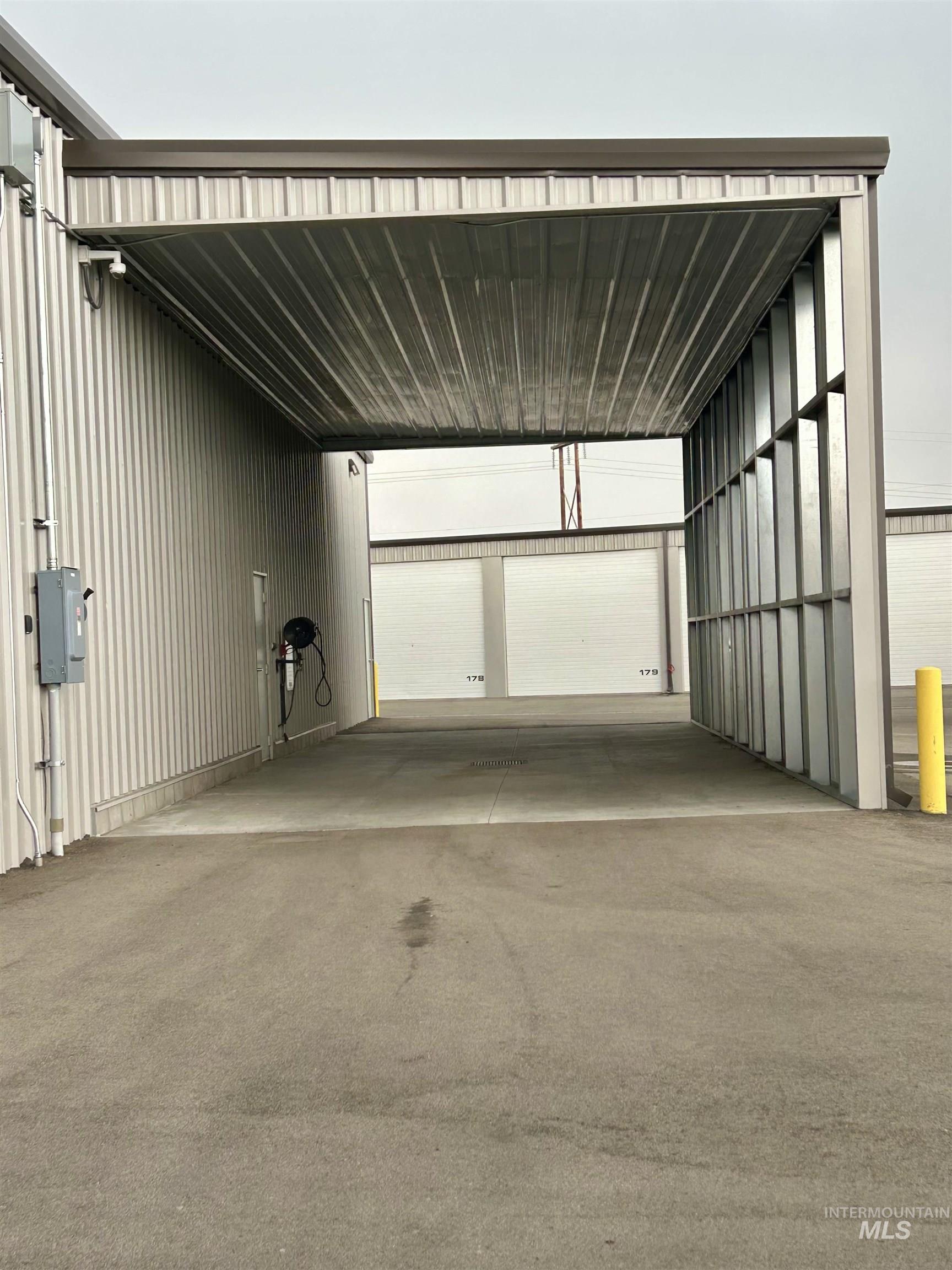 Garage featuring metal wall