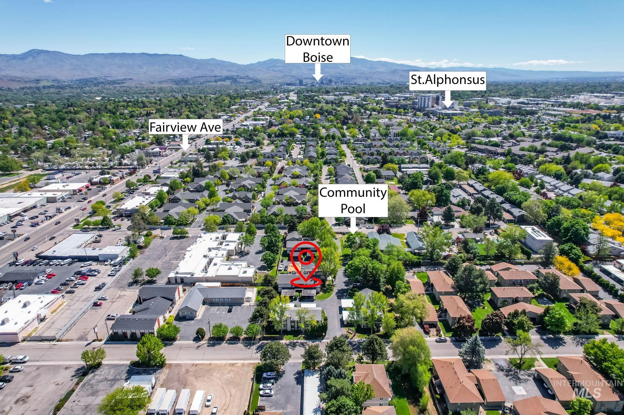 Aerial perspective of suburban area with a mountainous background