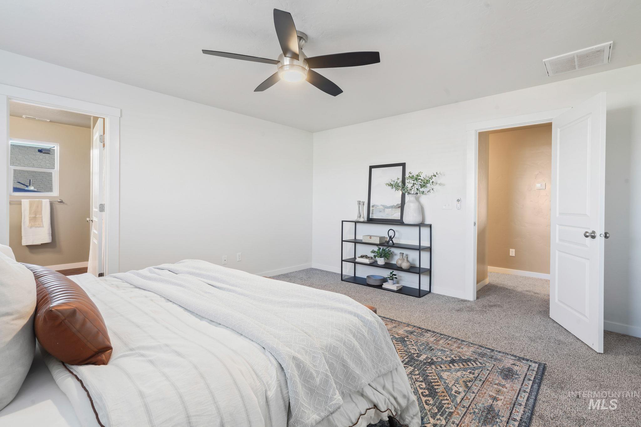 Bedroom featuring carpet flooring and a ceiling fan