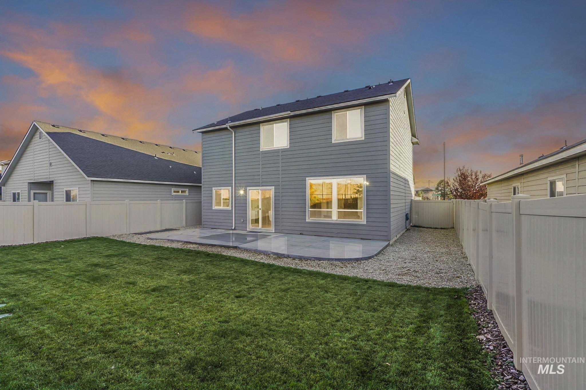 Back of property featuring a patio area and a fenced backyard