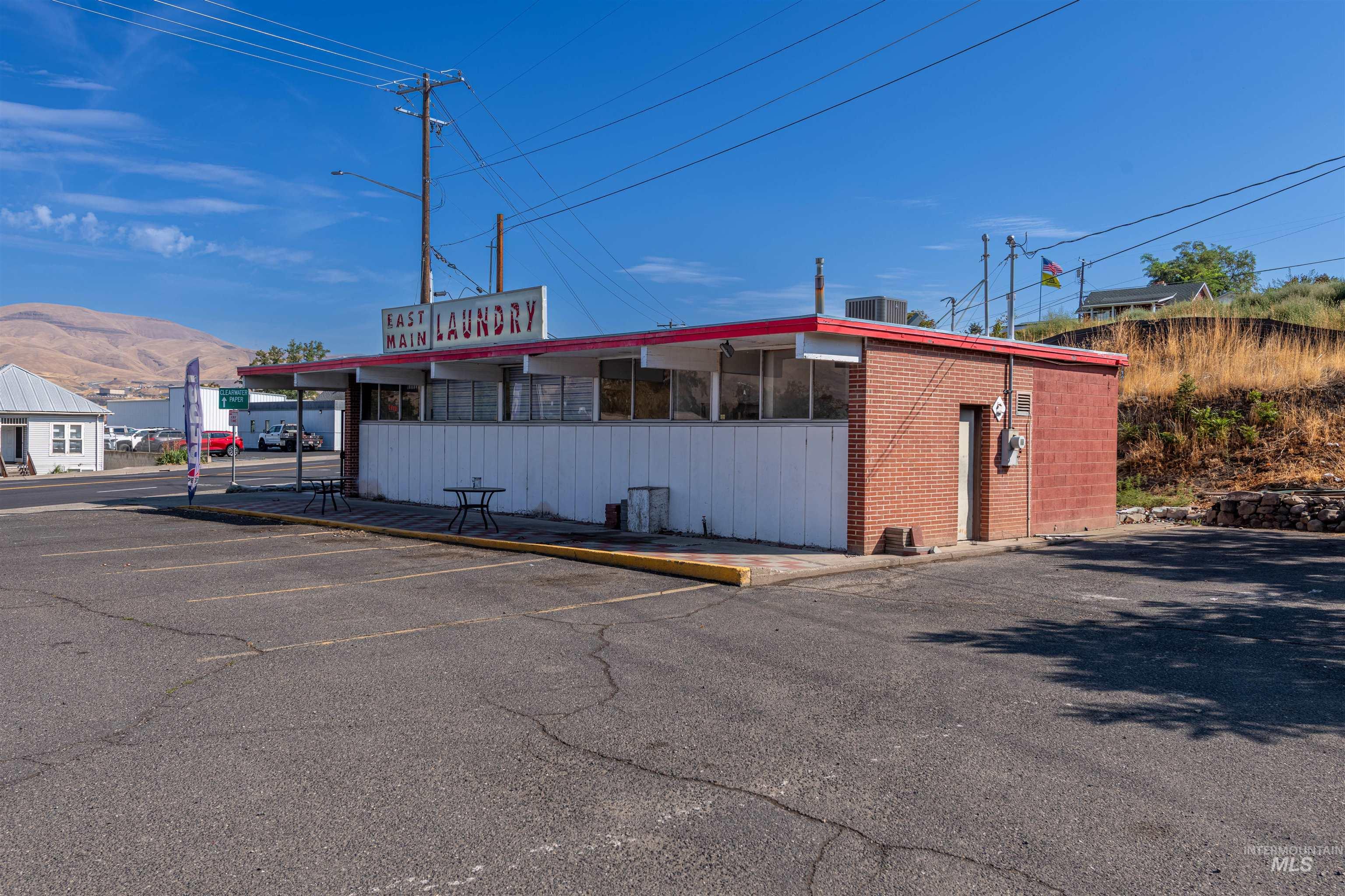 View of property with uncovered parking