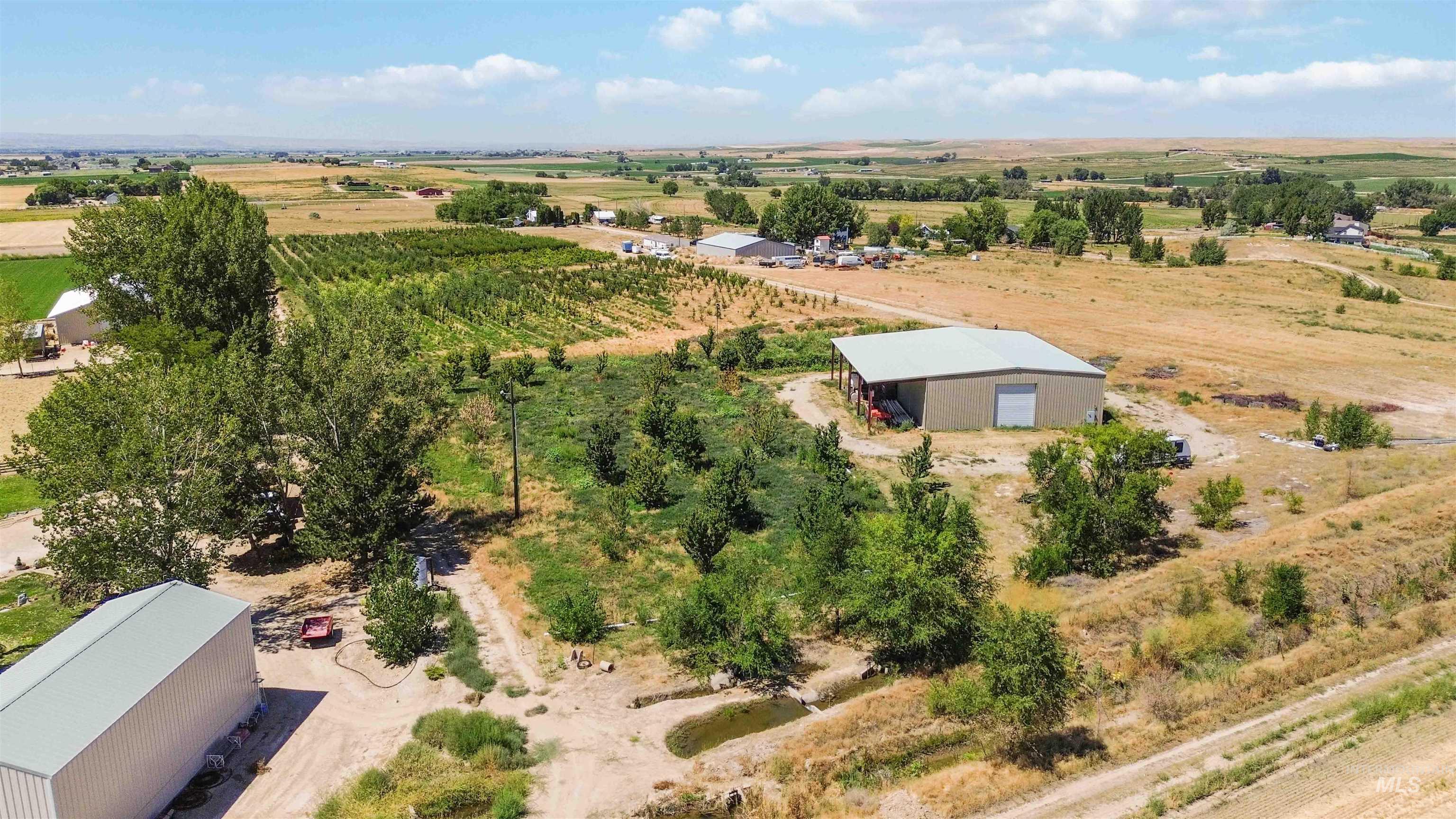 Aerial view of sparsely populated area featuring extensive farmland